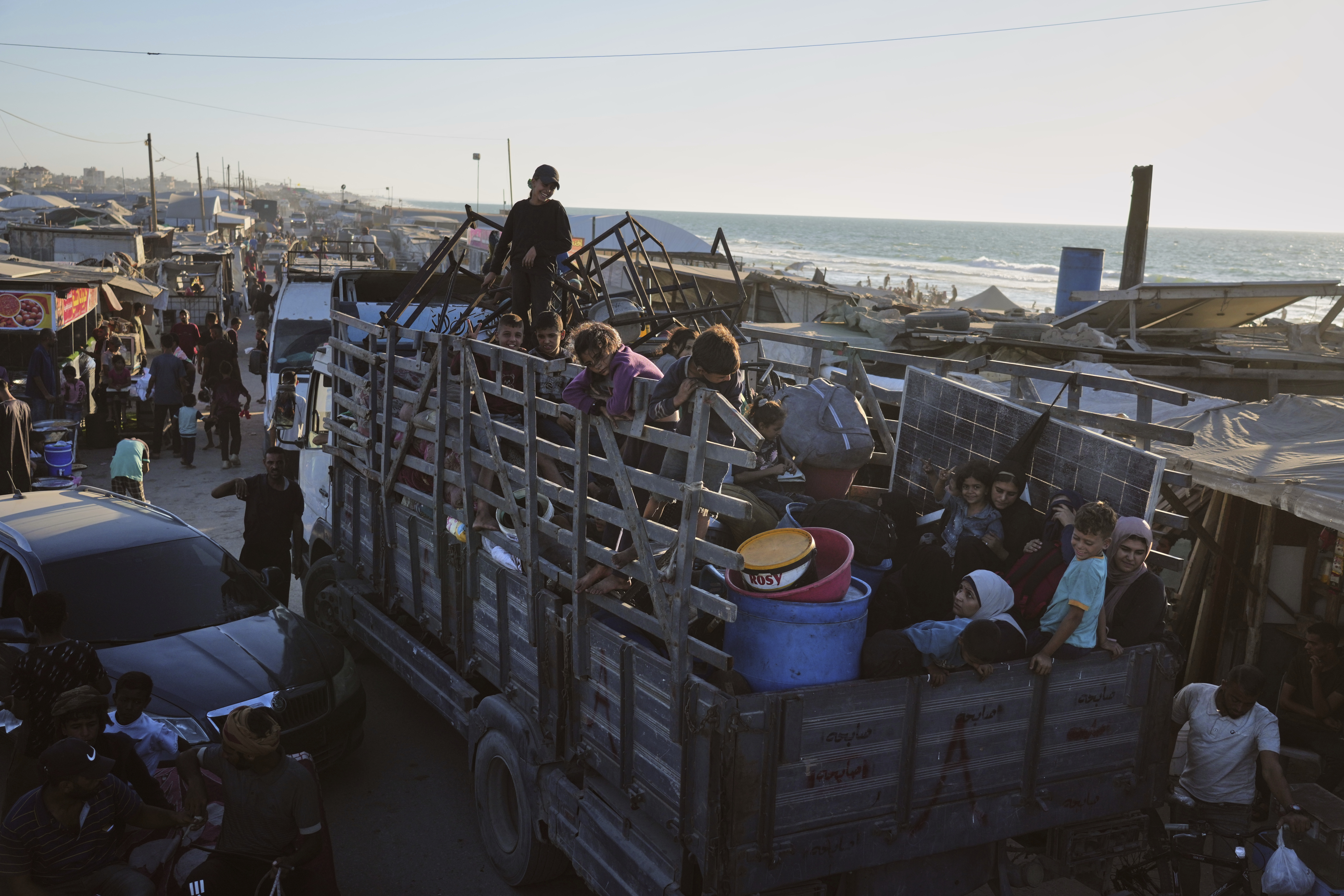 Displaced Palestinians fleeing Gaza City arrive in Muwasi, an area that Israel has designated as a safe zone, in Khan Younis southern Gaza Strip, Wednesday, Sept. 10, 2025. (Jehad Alshrafi - AP)