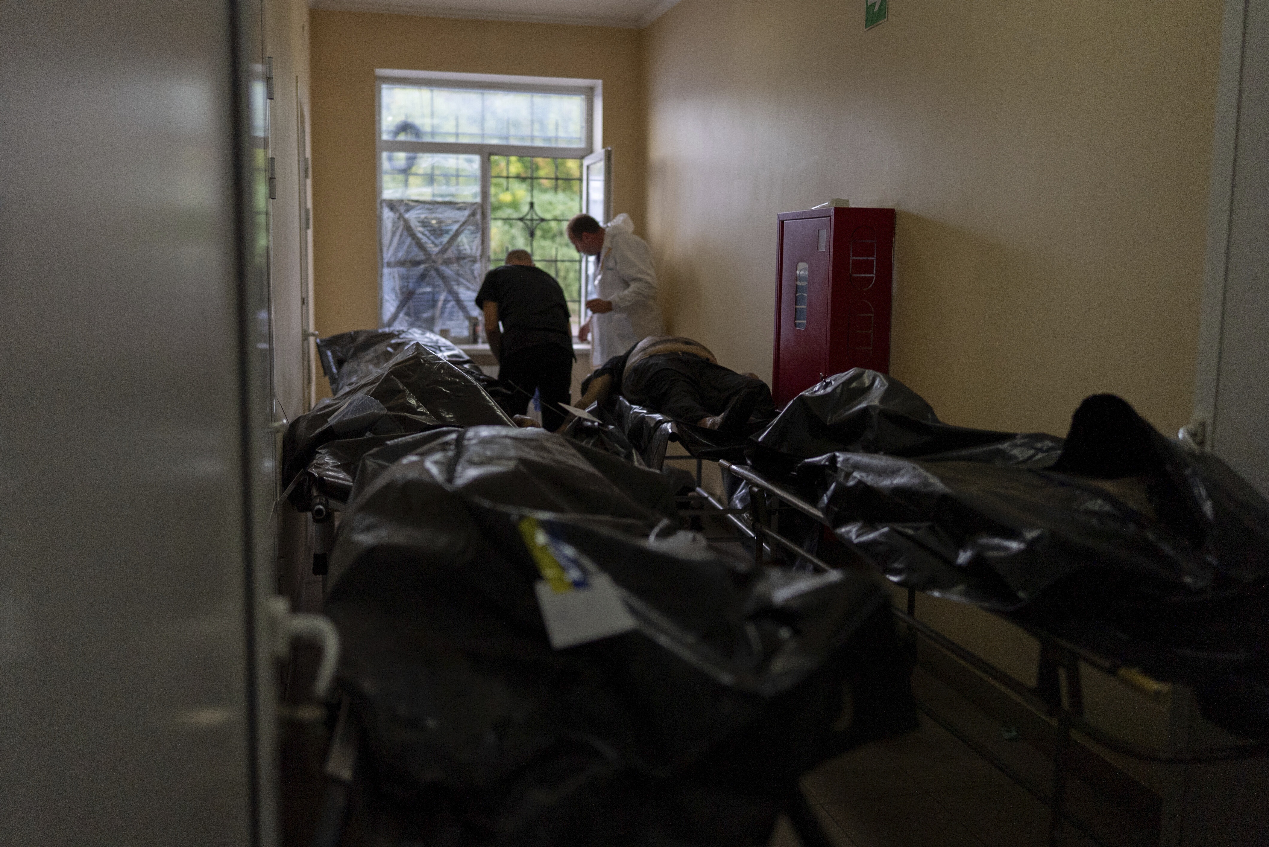 Bodies of civilians killed in a Russian aerial attack on village of Yarova, are seen at a morgue in Donetsk region, Tuesday, Sept. 9, 2025. (Alex Babenko - AP)