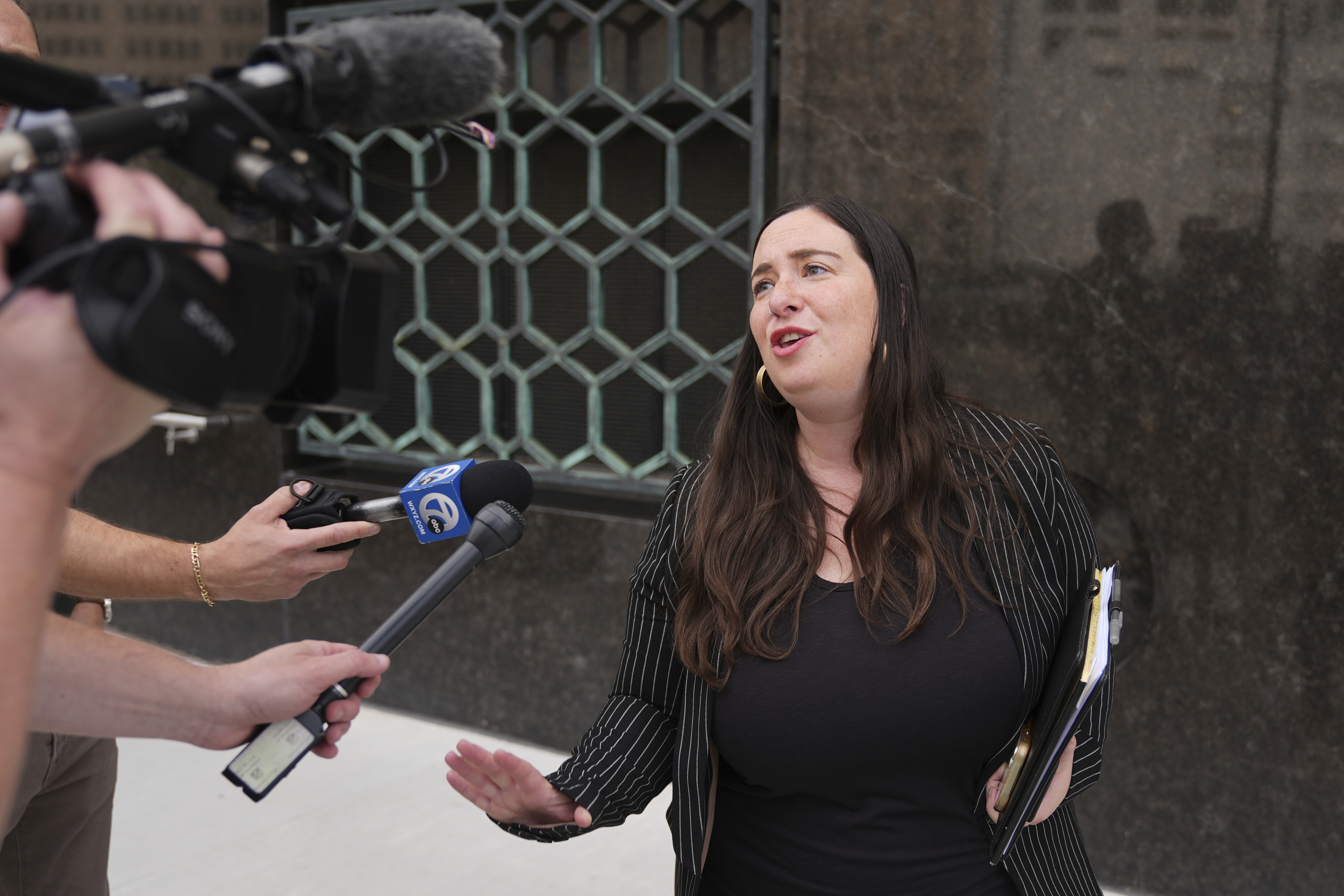 Sara Garber, attorney for Chengxuan Han, one of two Chinese scientists accused of smuggling or shipping biological material to the United States, speaks after a sentencing hearing at the U.S. District Court, Wednesday, Sept. 10, 2025, in Detroit. (Ryan Sun - AP)