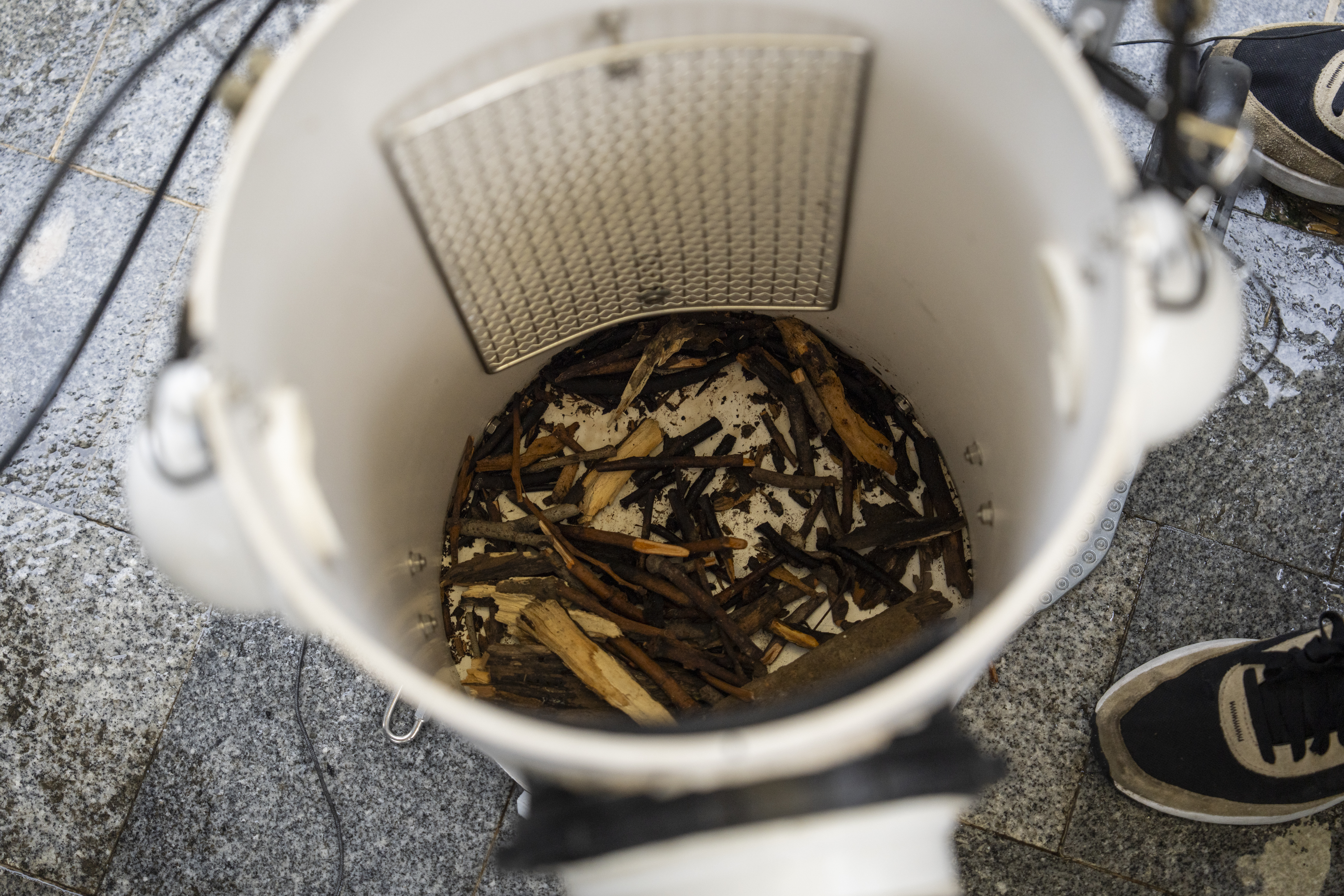 Sticks are placed on the bottom of an artificial nest box for wild yellow-crested cockatoos in Victoria Park in Hong Kong, on Aug. 18, 2025. (Chan Long Hei - AP)