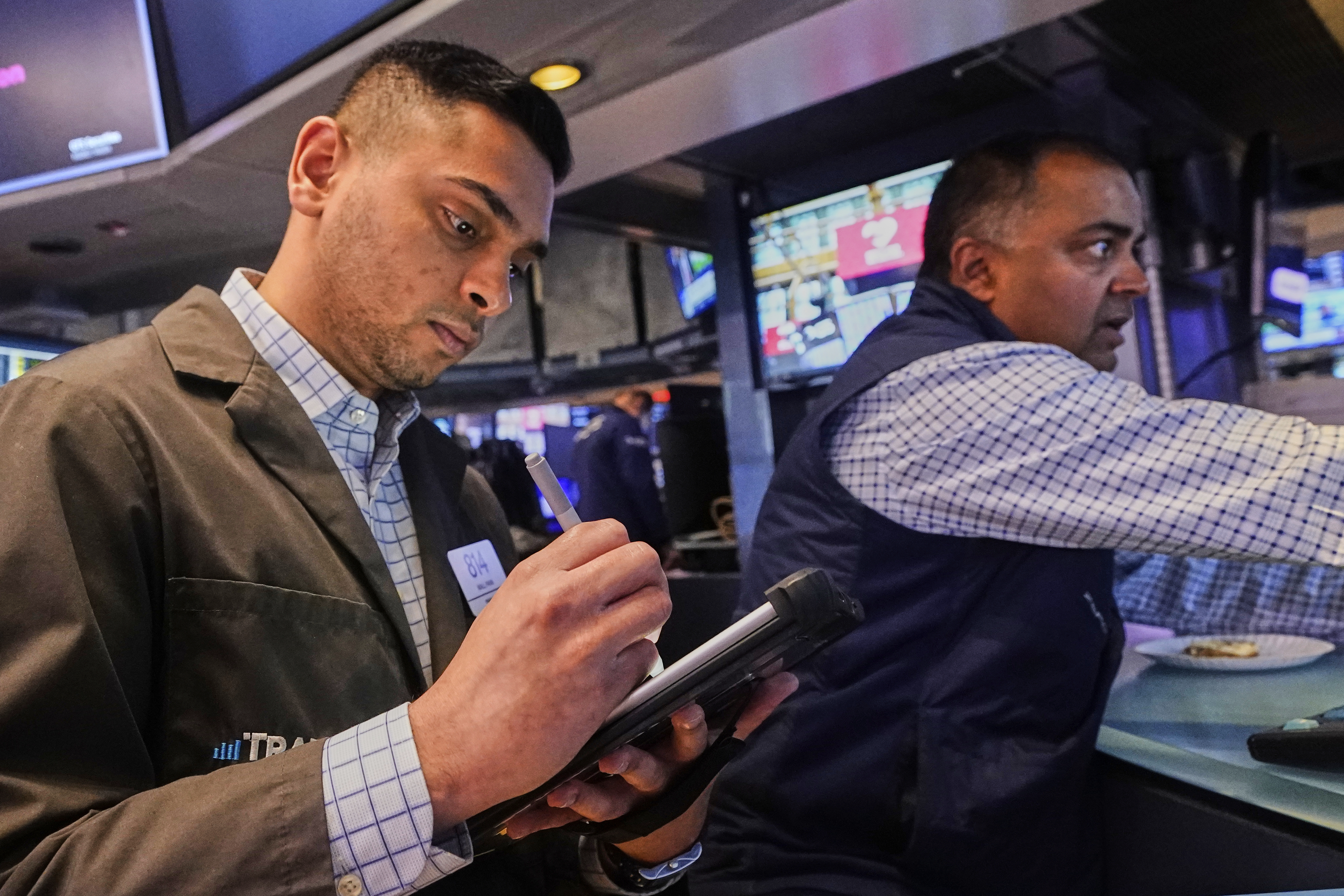 Trader Niall Pawa, left, and specialist Dilip Patel work on the floor of the New York Stock Exchange, Wednesday, Sept. 10, 2025. (Richard Drew - AP)
