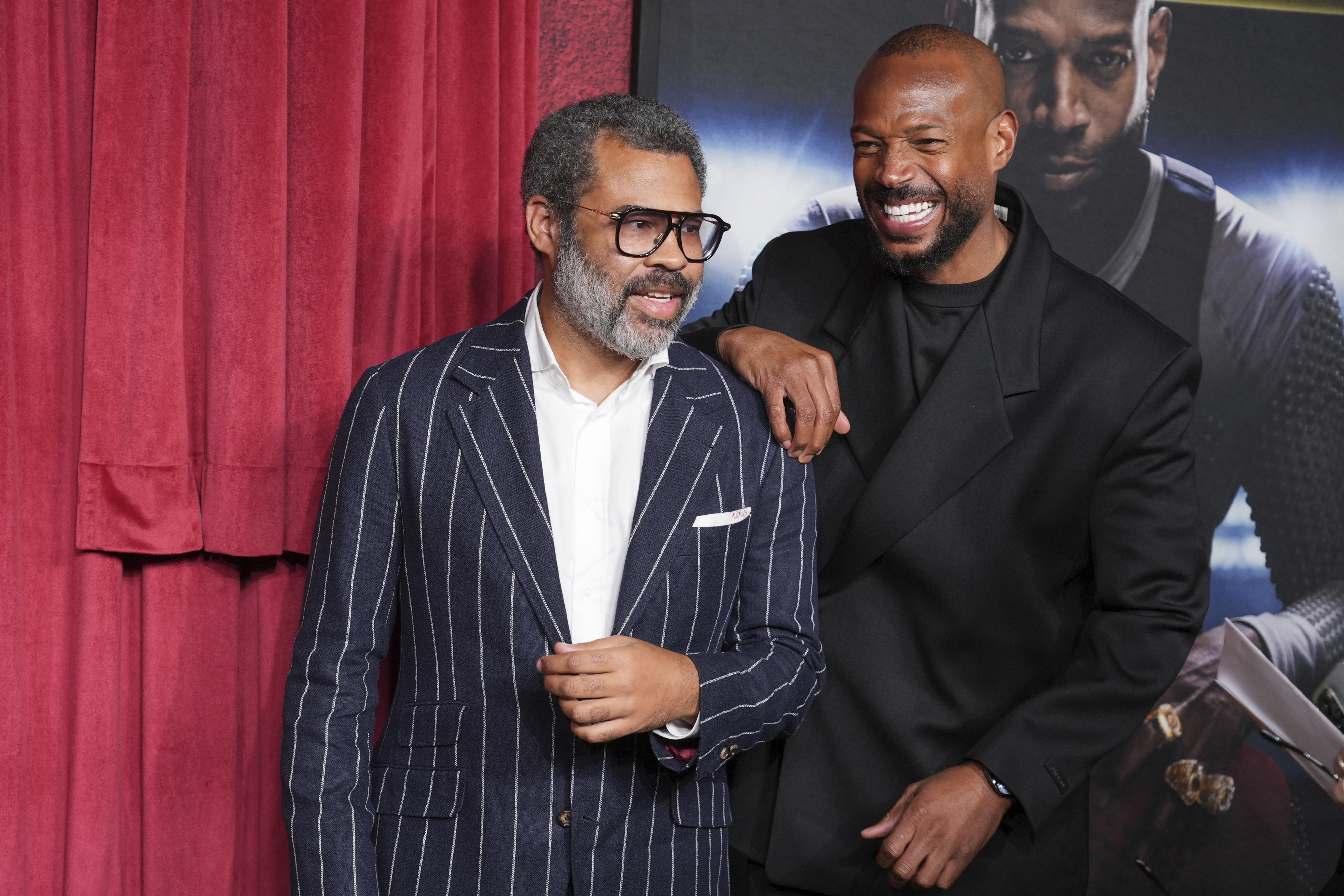Jordan Peele, left, and Marlon Wayans arrive at the premiere of
