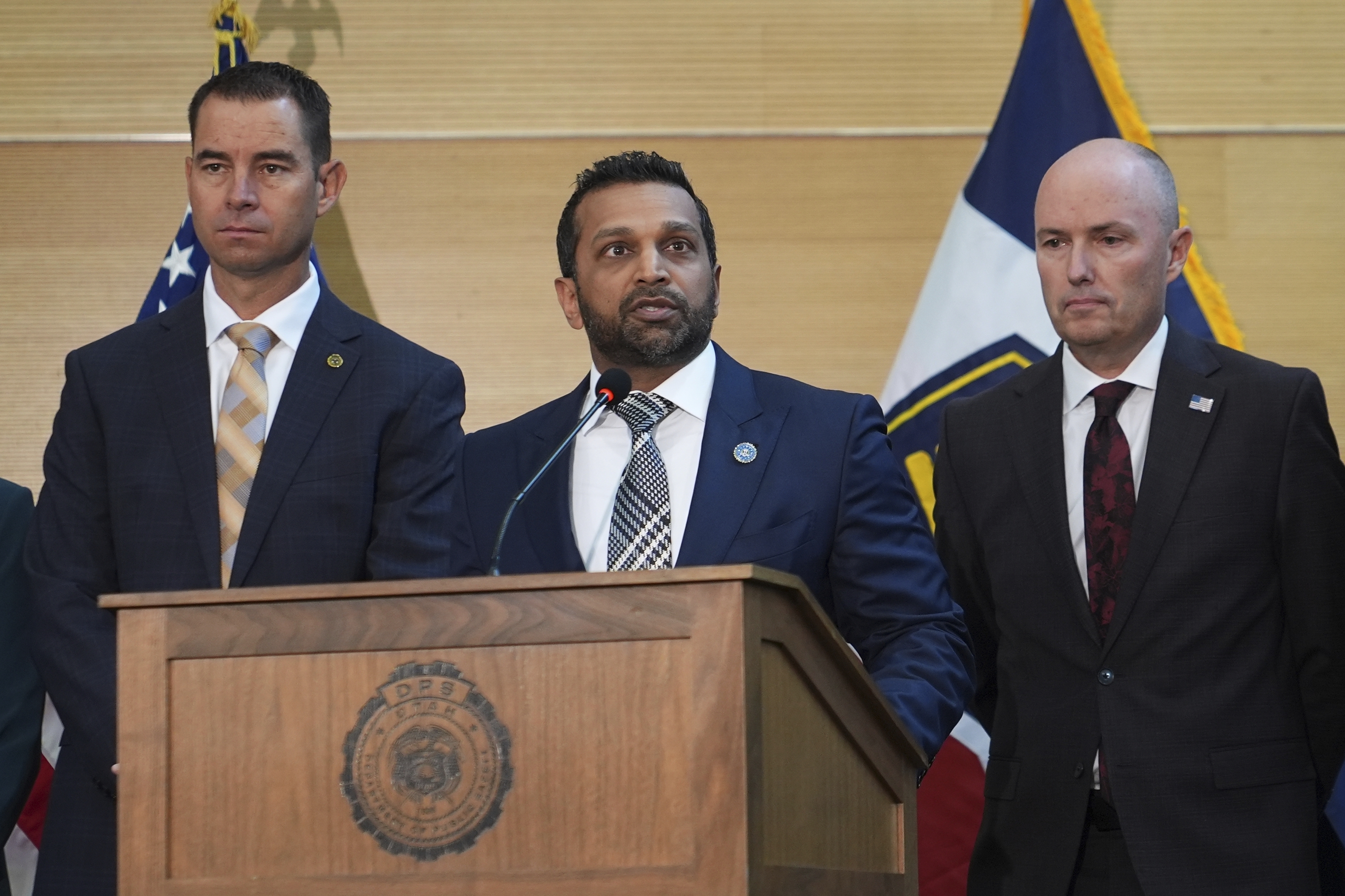 Kash Patel speaks at a news conference, Friday, Sept. 12, 2025, in Orem, Utah, as Utah department of public safety commissioner Beau Mason, left, and Utah Gov. Spencer Cox listen. (Lindsey Wasson - AP)