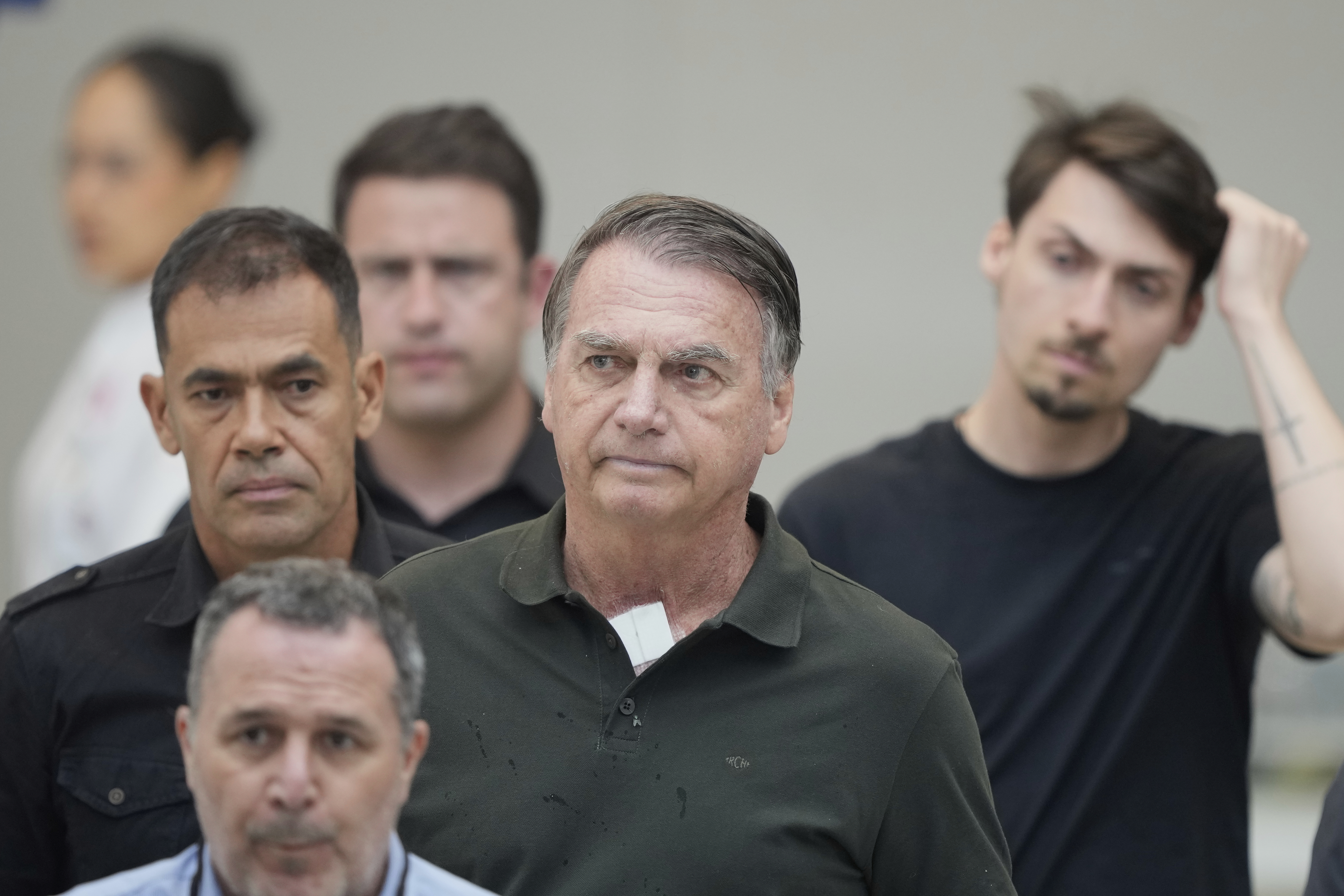 Former President Jair Bolsonaro, temporarily allowed out of house arrest for medical treatment, departs a hospital in Brasilia, Brazil, Sunday, Sep. 14, 2025. (Eraldo Peres - AP)