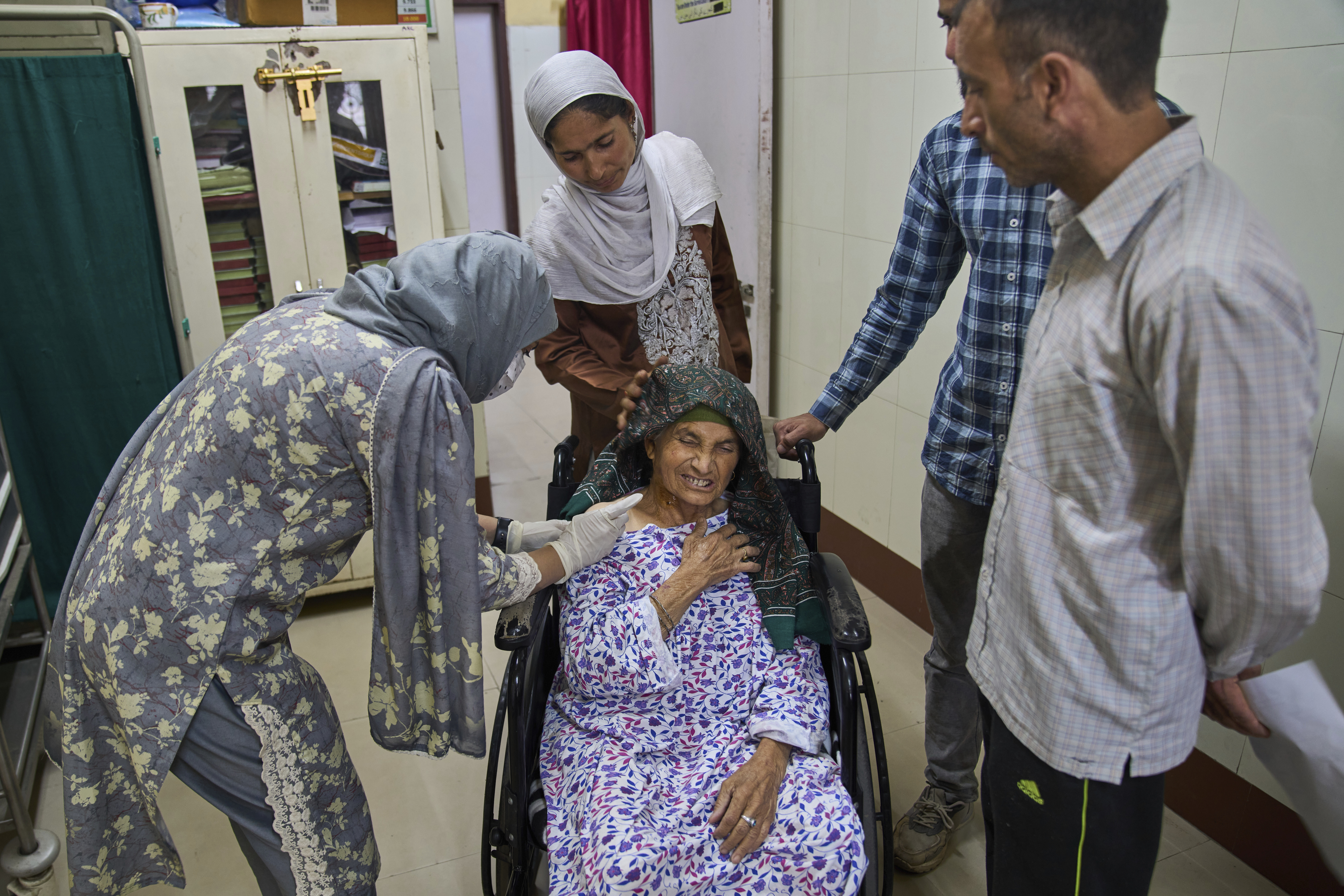 Fazi, a 60-year-old woman, grimaces as she receives a dose of vaccine after being attacked by a pack of stray dogs inside the compound of her house at the anti-rabies clinic at a hospital in Srinagar, Indian controlled Kashmir, Thursday, Sept. 18, 2025. (Dar Yasin - AP)