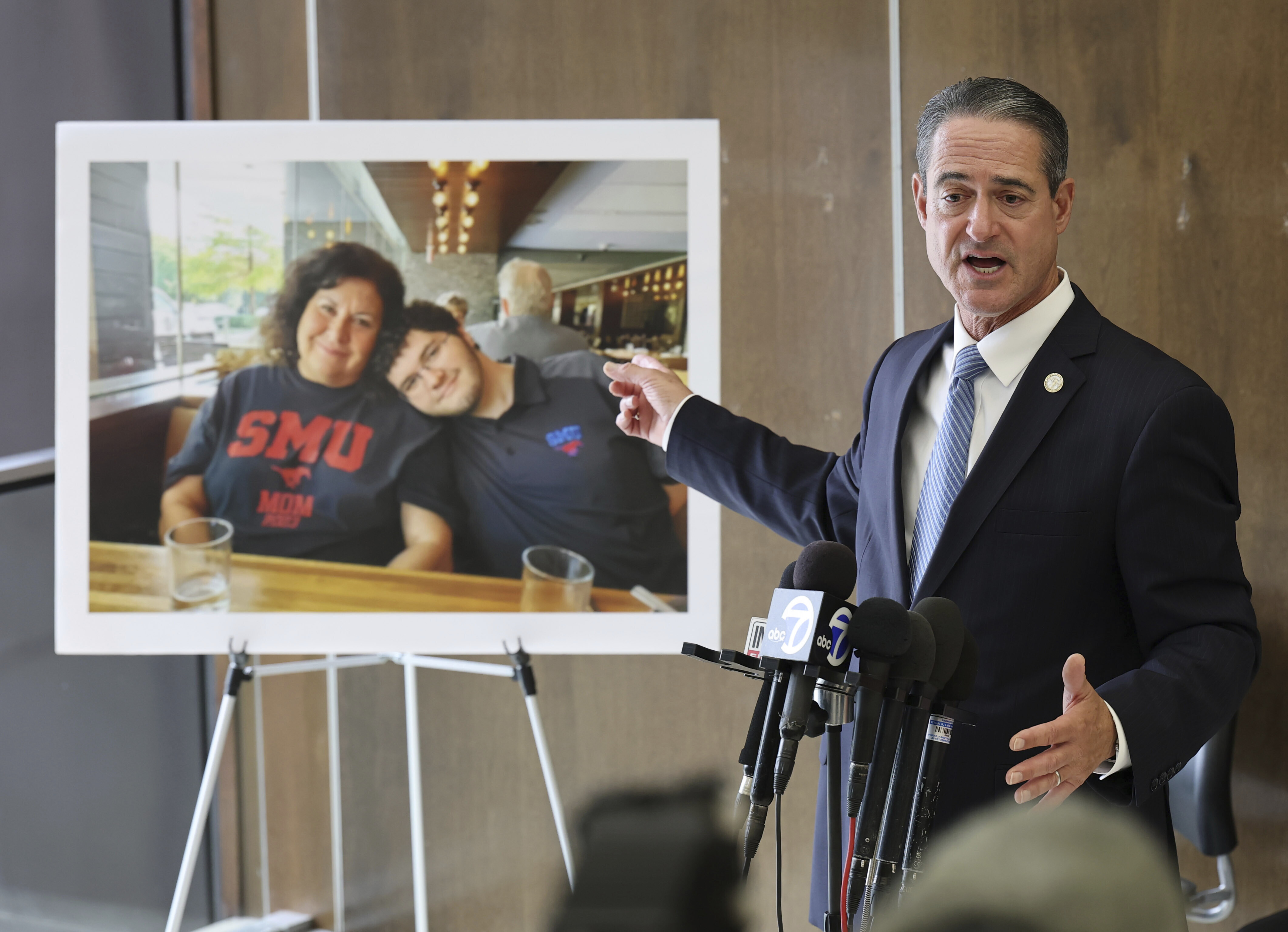 A photo of Sheryl Ferguson, the wife and son Phillip Ferguson of Orange County Superior Judge Jeffrey Ferguson is displayed as Orange County District Attorney Todd Spitzer speaks to the media after Orange County Superior Court Judge Jeffrey Ferguson was sentenced to 35 years to life in prison after his second-degree murder conviction for shooting his wife following an argument at the Central Justice Center in Santa Ana, Calif., Wednesday, Sept. 17, 2025. (Allen J. Schaben - Pool Los Angeles Times)