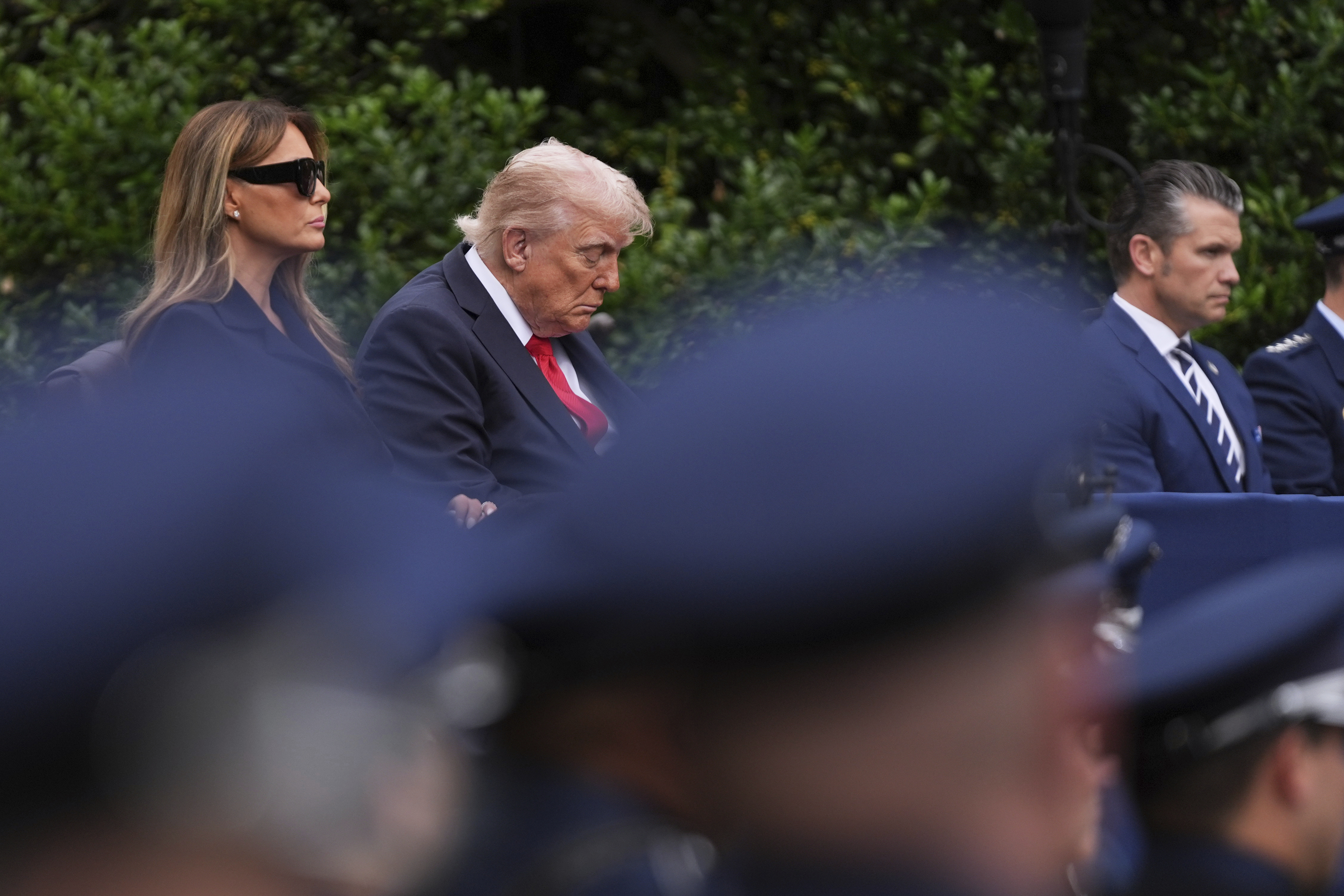 President Donald Trump, first lady Melania Trump and Defense Secretary Pete Hegseth, listen as names are read during a ceremony to commemorate the 24th anniversary of the 9/11 attacks, Thursday, Sept. 11, 2025, at the Pentagon in Washington. (Evan Vucci - AP)