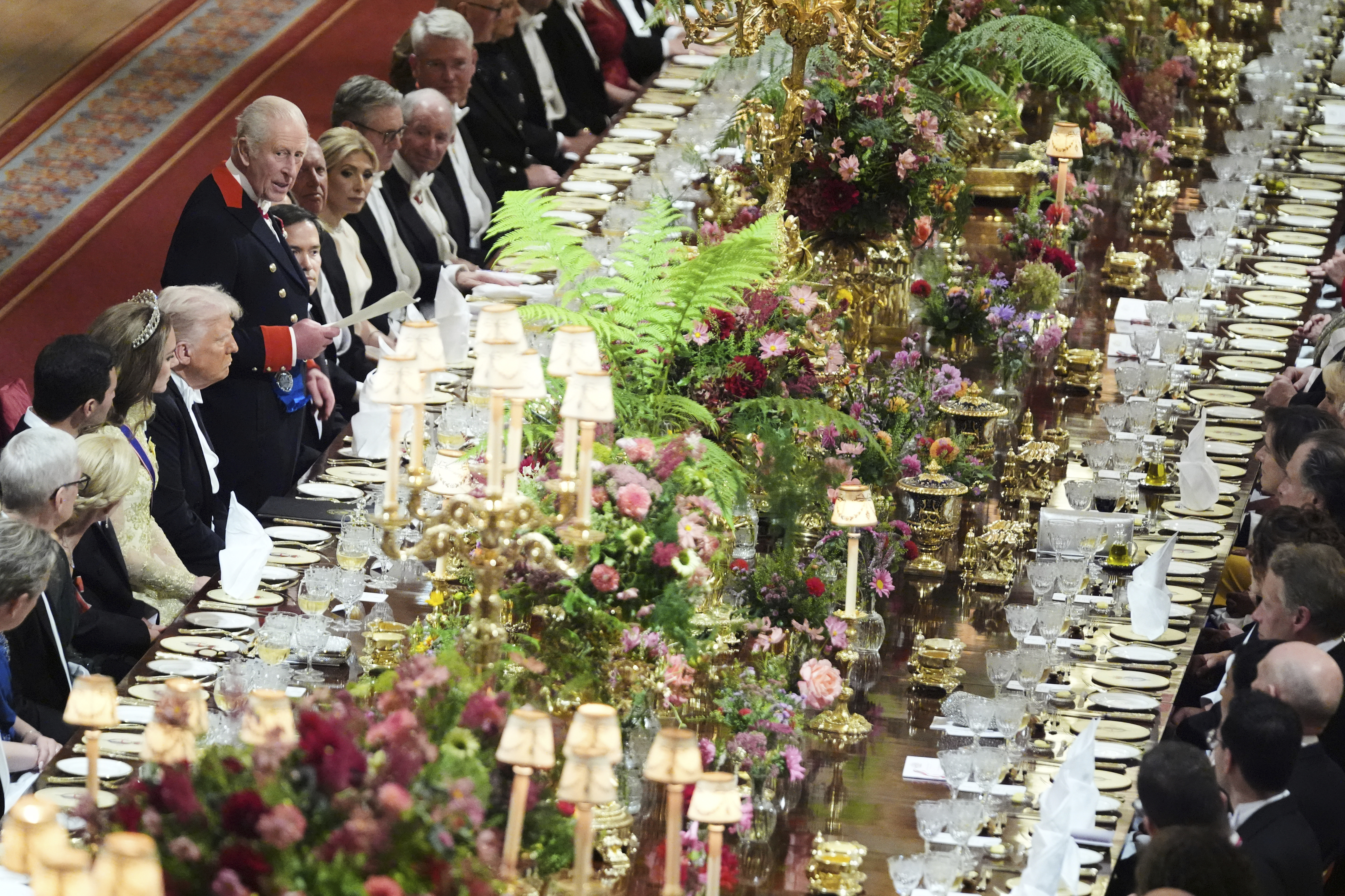 Britain's King Charles III, center left, speaks at a State Banquet during a State visit of President Donald Trump at Windsor Castle in Windsor, England, Wednesday, Sept. 17, 2025. (Evan Vucci - Pool AP)