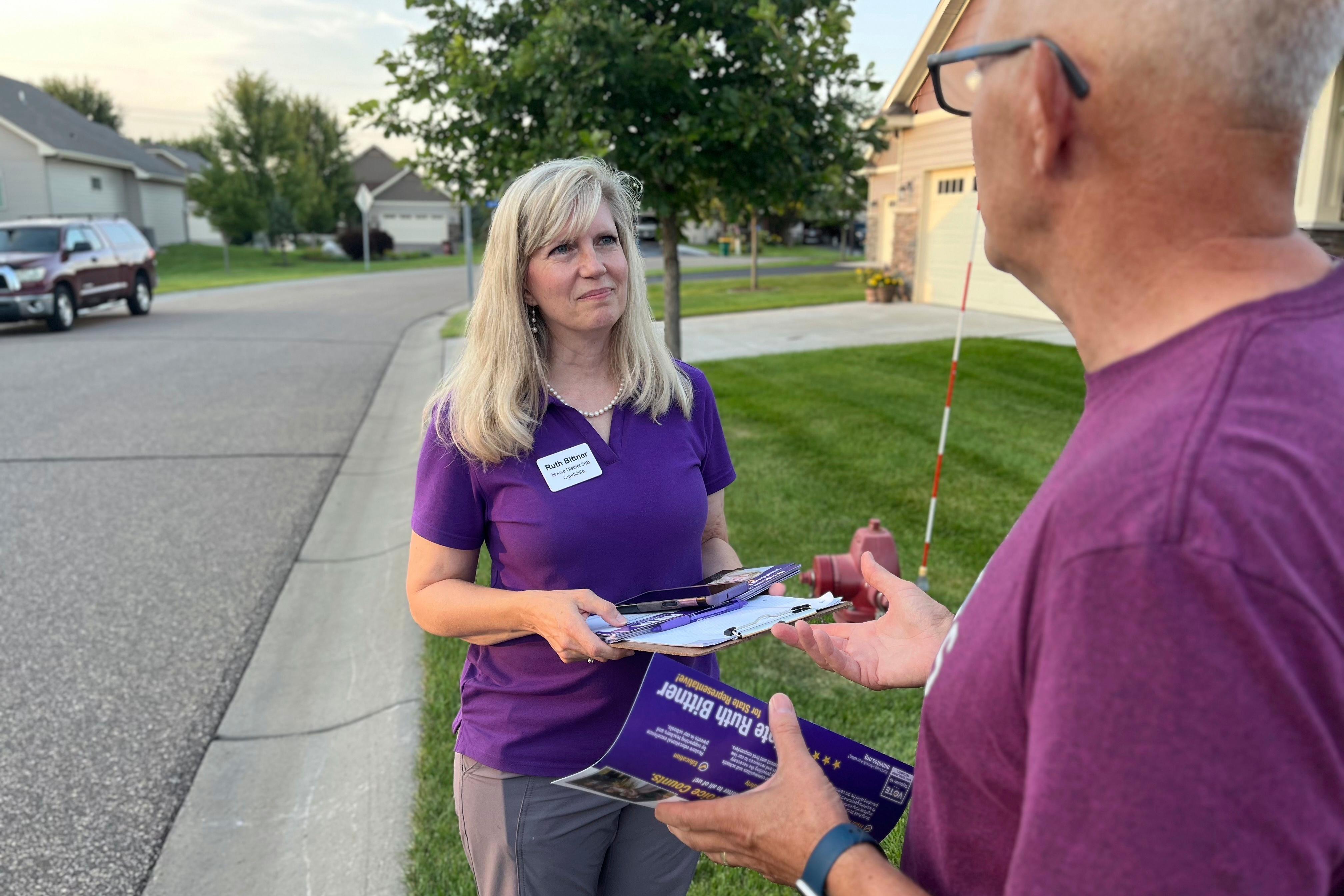 Republican candidate Ruth Bittner, who is running for the House District 34B seat, speaks with a potential voter while knocking on doors in Brooklyn Park, Minn., Thursday, Aug. 28, 2025. (Nathaniel Minor - Star Tribune)