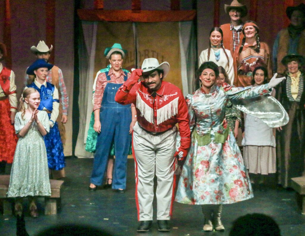 Actors Daniel Sares and Michele Crowe take their bows as Frank Butler and Annie Oakley following Friday’s (Sept. 19) performance of Ovation West’s ‘Annie Get Your Gun,’ the first since the Evergreen High School shootings. JOHN MOORE/DENVER GAZETTE