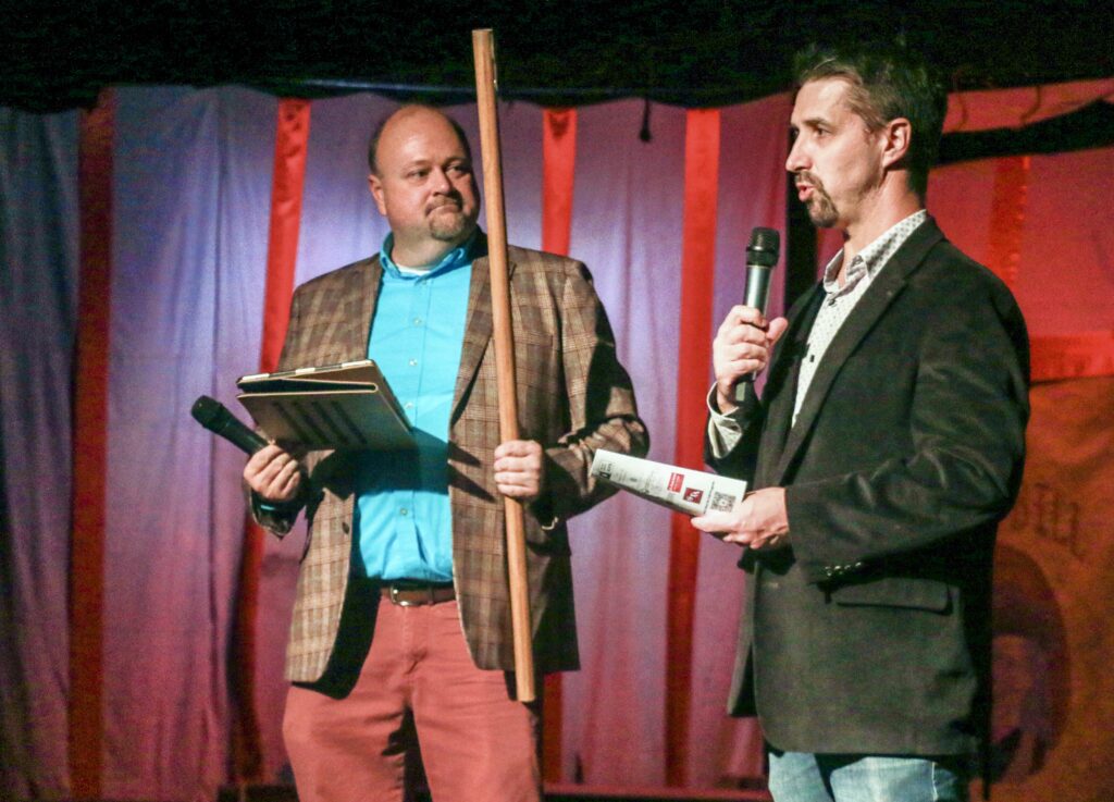 Director Tim Kennedy, left, and Ovation West Executive Director Graham Anduri address the audience at the first performance of 'Annie Get Your Gun' after the Evergreen High School shooting on Sept. 10, 2025. Photo taken Sept. 19, 2025. (John Moore, Denver Gazette)