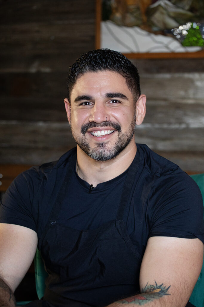 Chef and co-owner of Riot BBQ Manny Barella poses for a photo Thursday, Sept. 4, 2025 at his restaurant in Denver's Overland Park neighborhood