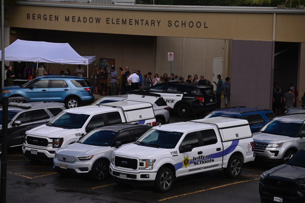 Hundreds of parents lined up at Bergen Meadow Elementary to pick up their Evergreen High School student after a shooting left three critically injured. (Stephen Swofford/Denver Gazette)
