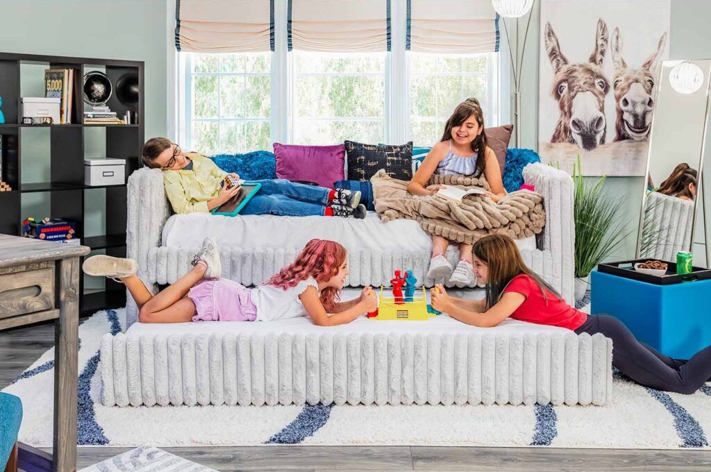 Kids hanging out in bedroom