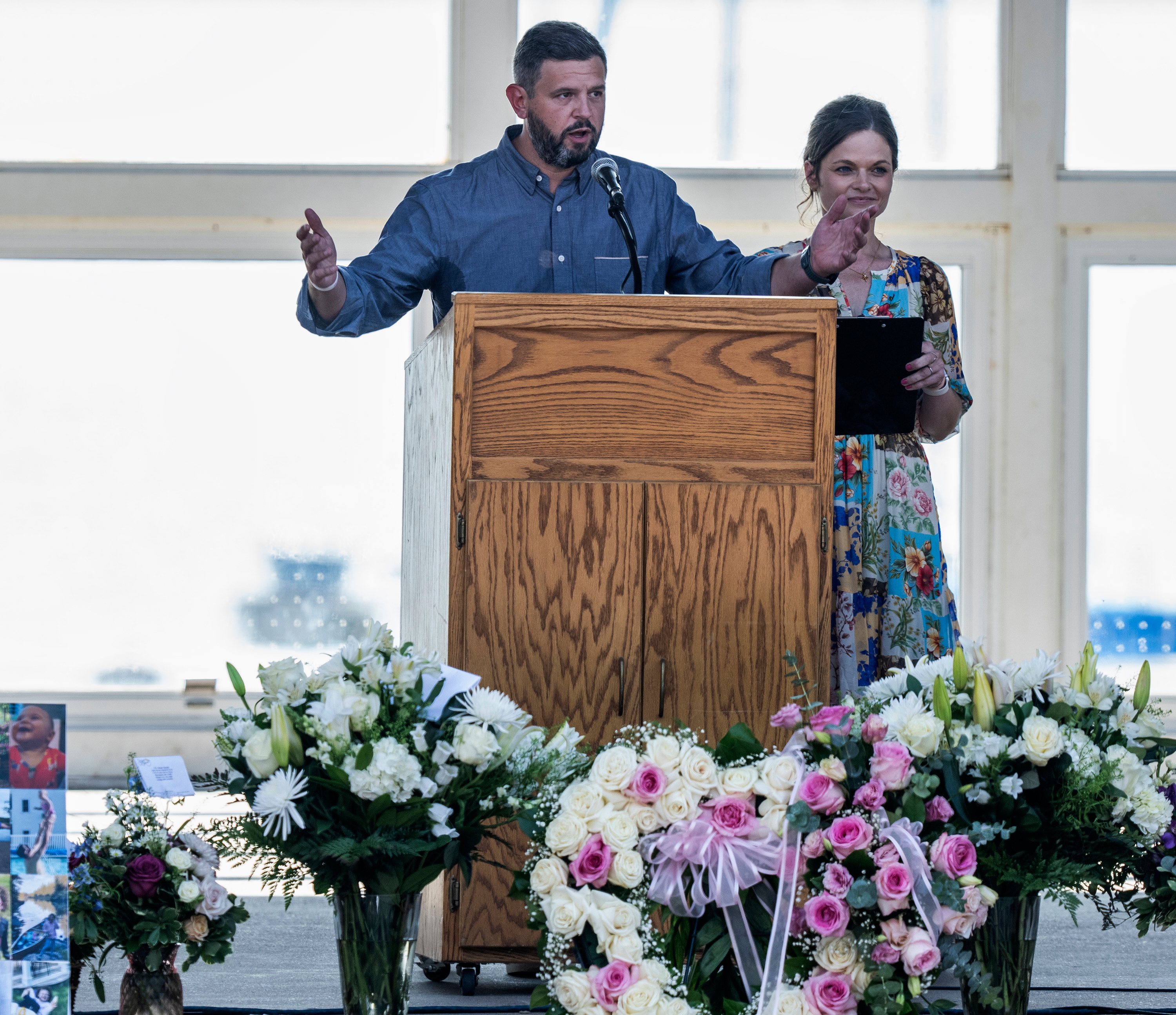 Parents Mike Moyski and Jackie Flavin thank the attendees who gathered for the celebration of life for Harper Moyski, who was killed in the Annunciation Catholic School church shooting, at the Lake Harriet Bandshell in Minneapolis, Minn., on Sunday, Sept. 14, 2025. (Richard Tsong-Taatarii - Star Tribune)