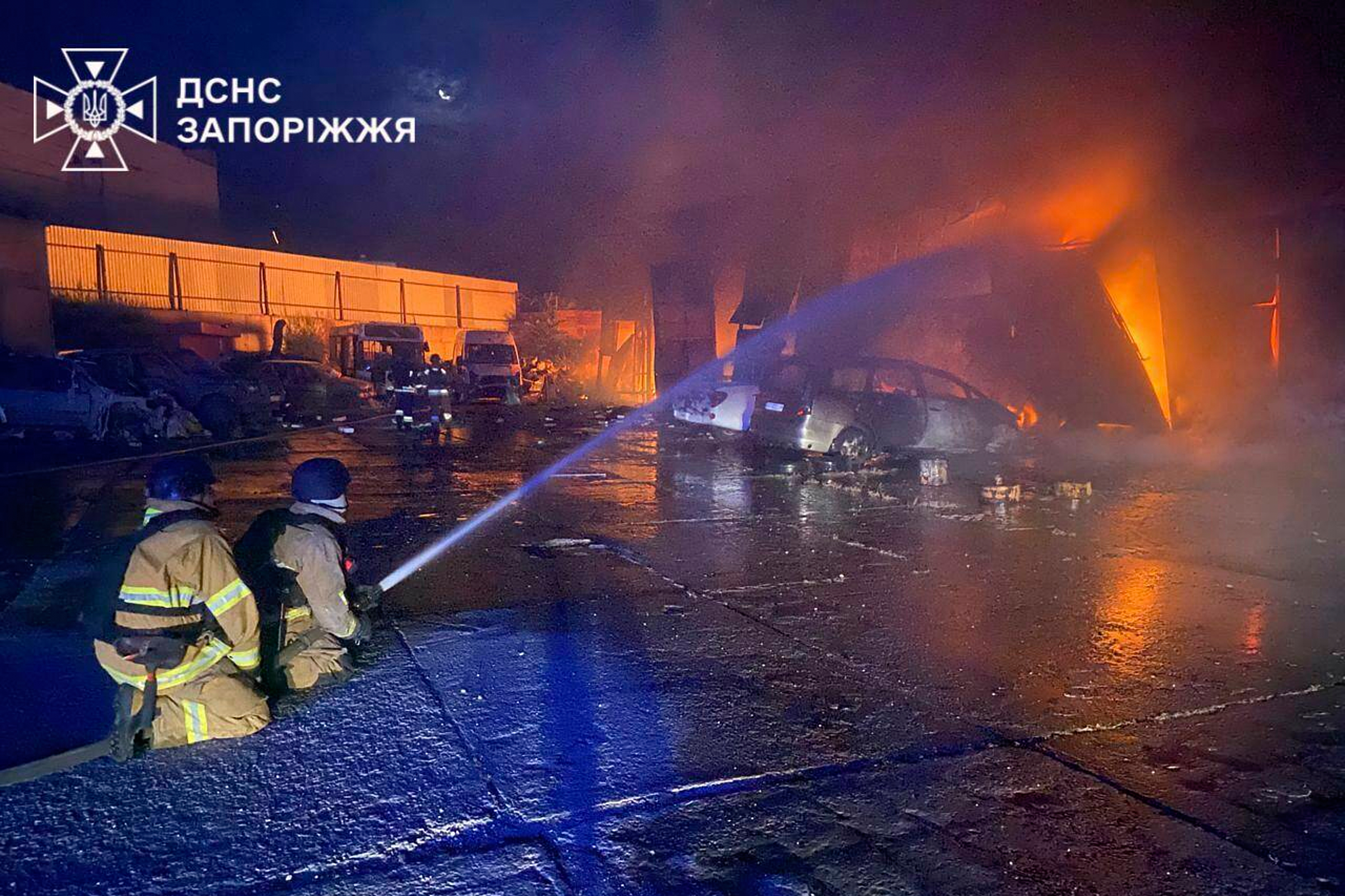 In this photo provided by the Ukrainian Emergency Services on Tuesday, Sept. 16, 2025, rescue workers put out a fire of a building destroyed by a Russian strike in Zaporizhzhia, Ukraine. (Ukrainian Emergency Service - Ukrainian Emergency Service)