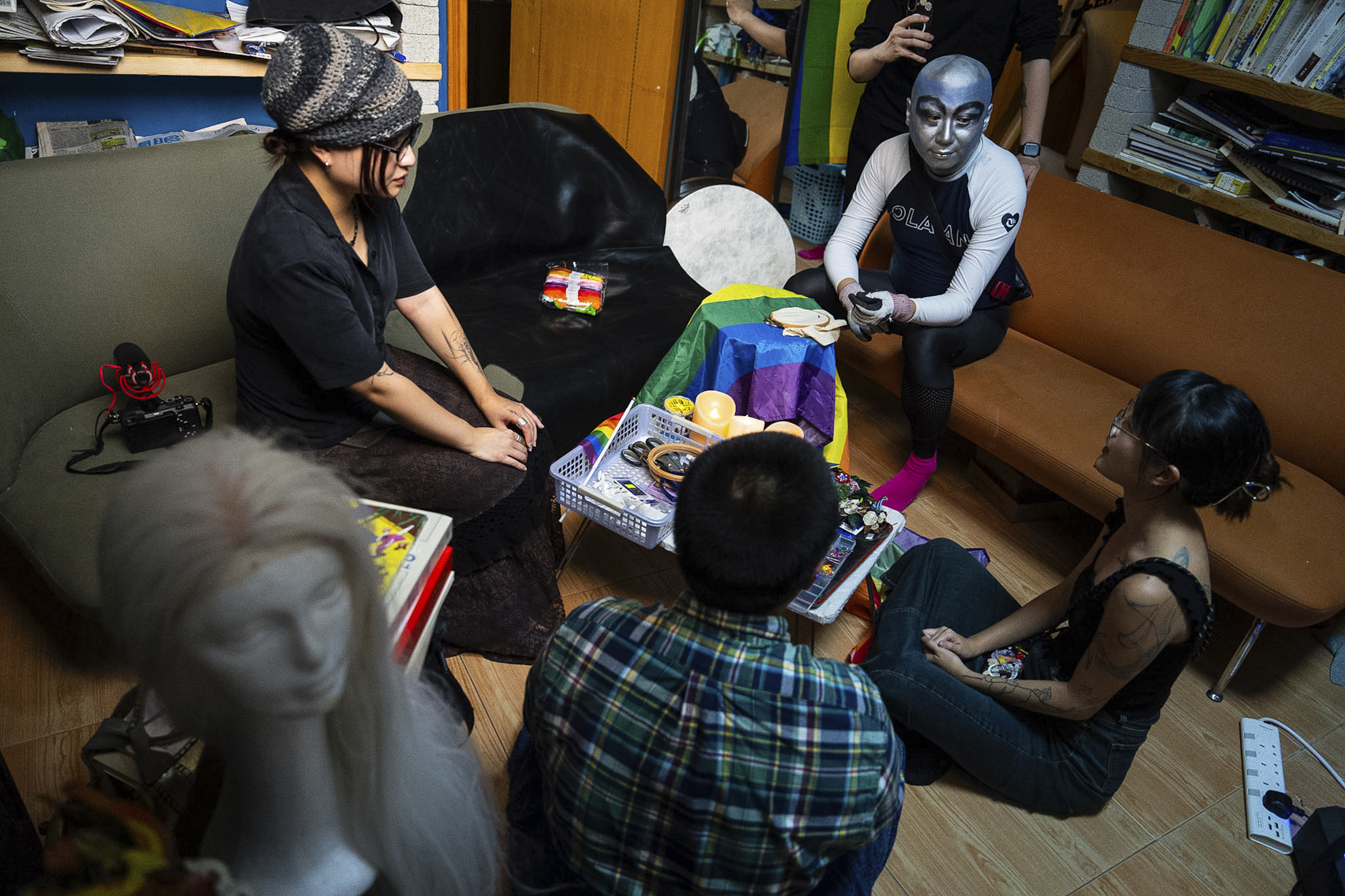Performance artist Holok Chen gathered several peers in the queer community to embroider on a rainbow flag in Hong Kong, Wednesday, Sep. 10, 2025. (Chan Long Hei - AP)