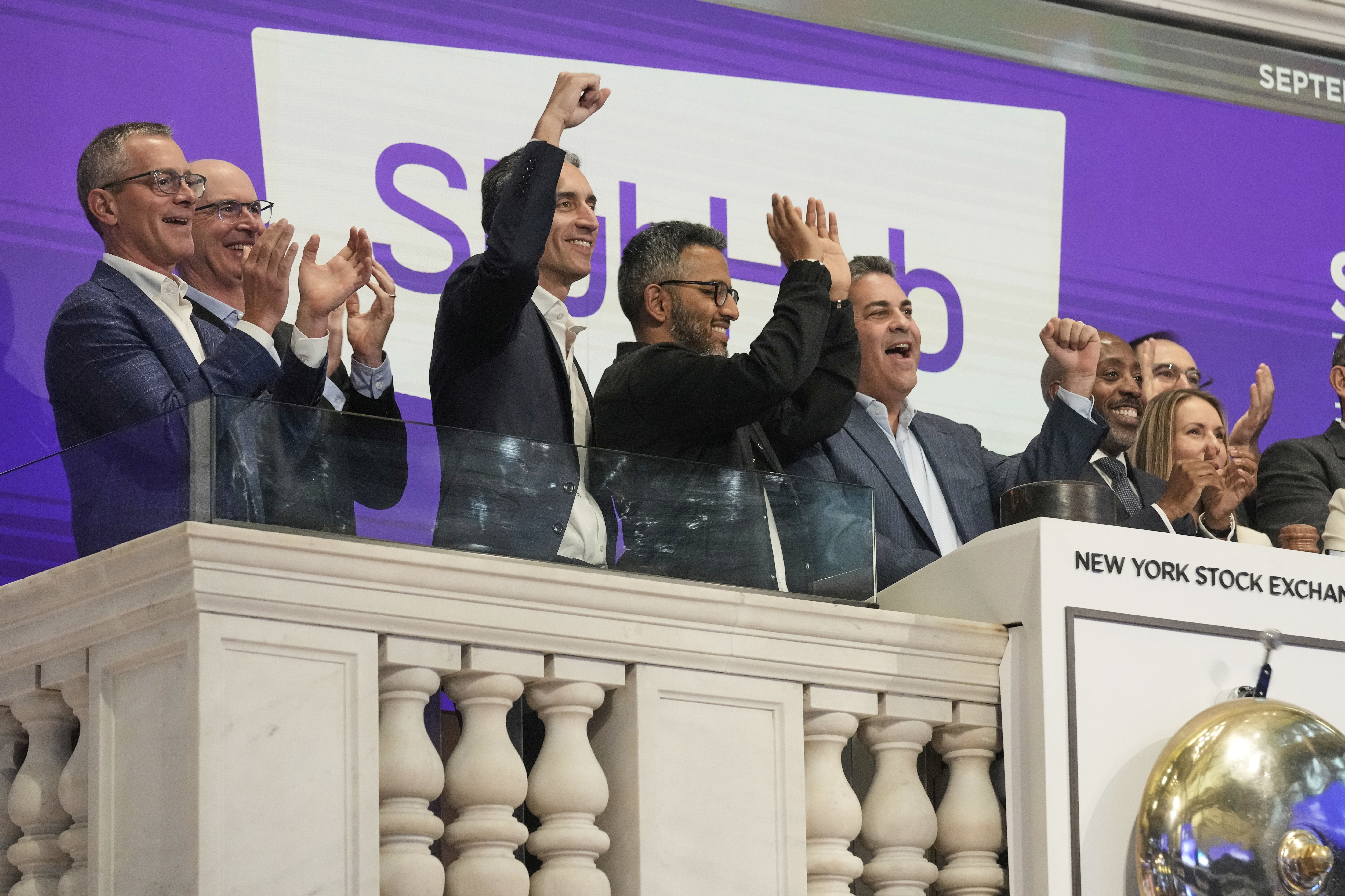 StubHub President Nayaab Islam, third from right, and CEO Eric Baker, second from right, celebrate as they ring the New York Stock Exchange opening bell before the company's IPO, Wednesday, Sept. 17, 2025. (Richard Drew - AP)