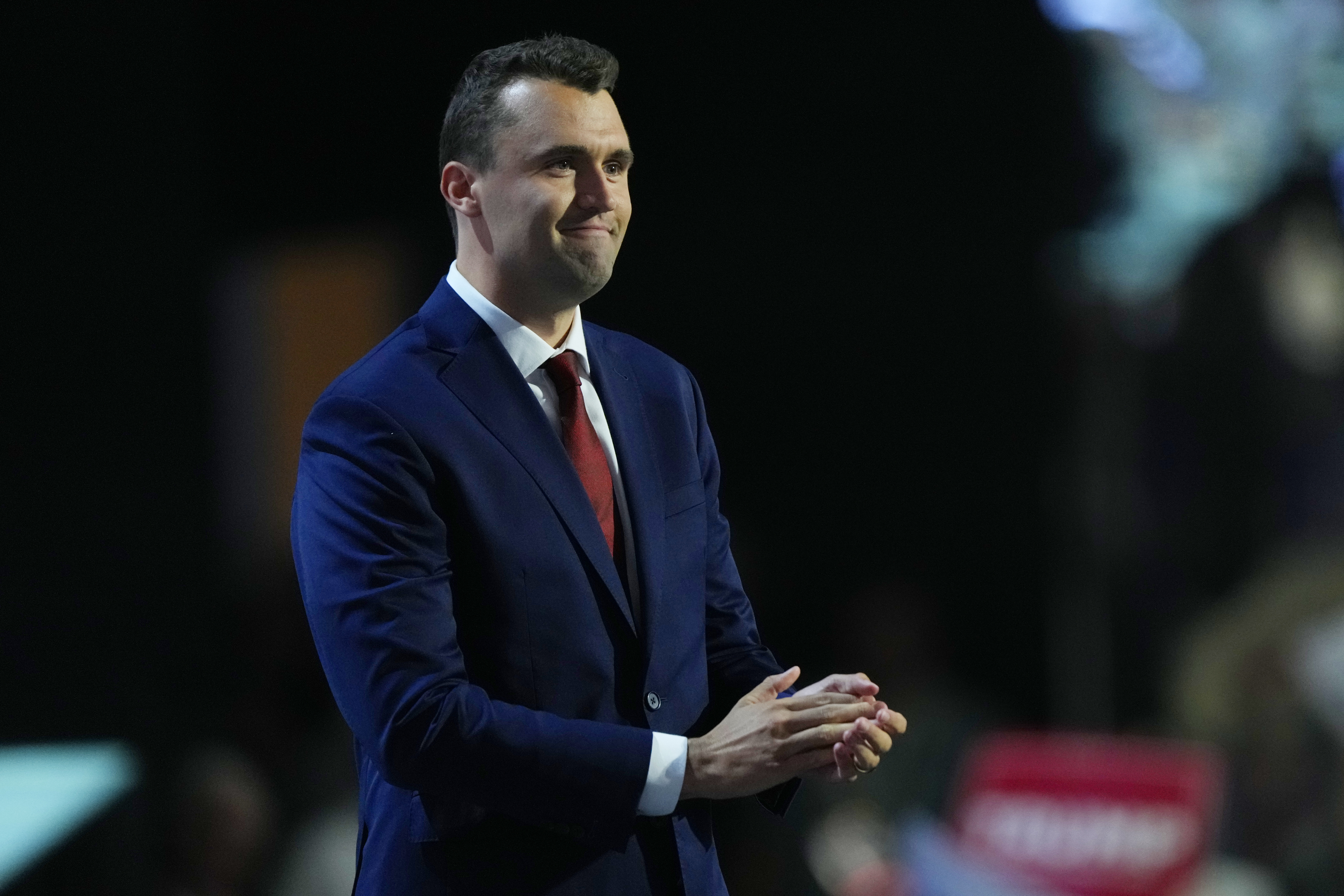 FILE- Charlie Kirk, co-founder of Turning Point USA, stands during microphone check before the start of the first day of the Republican National Convention, July 15, 2024, in Milwaukee. (Matt Rourke - AP)