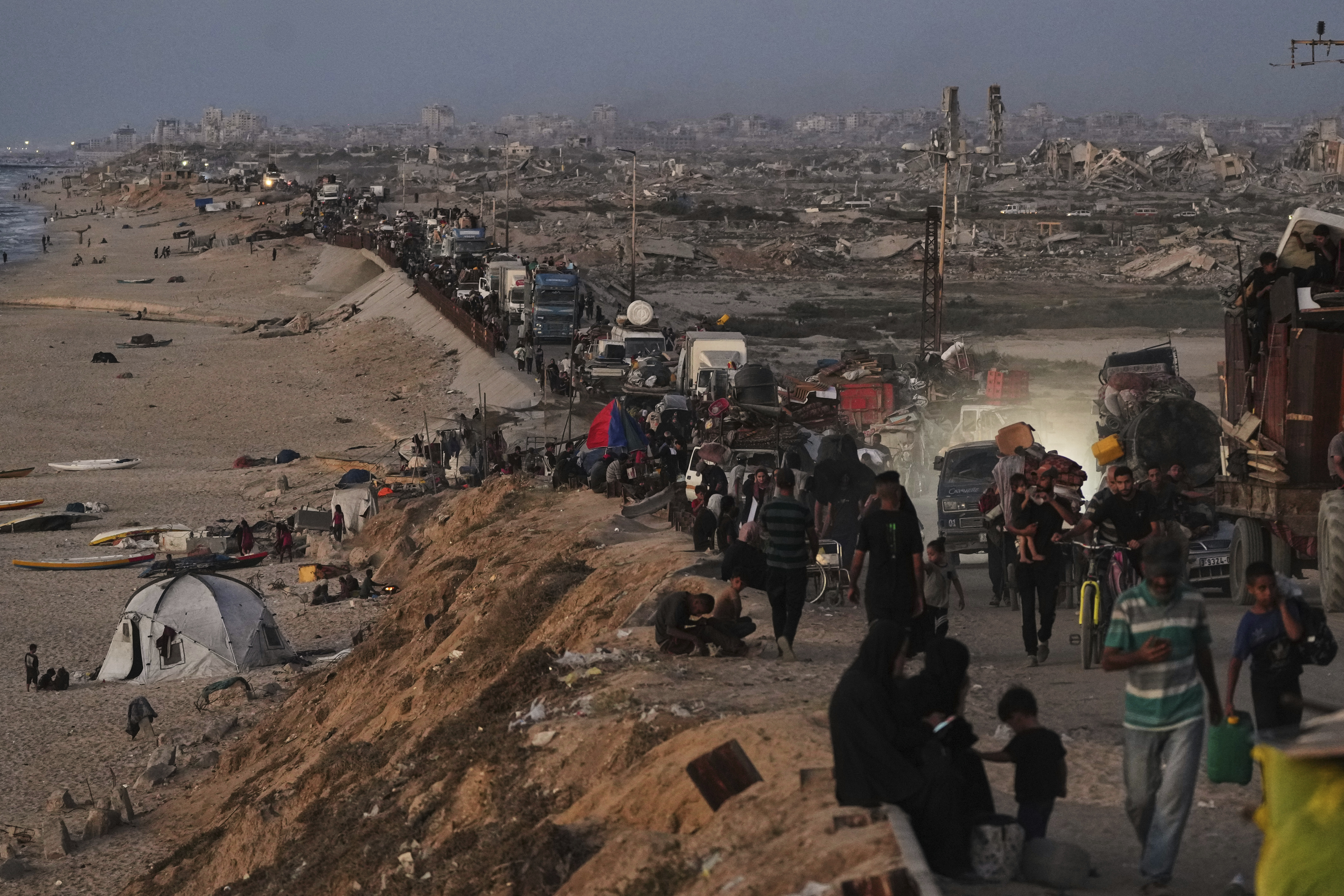 Displaced Palestinians flee northern Gaza along the coastal road toward the south, as Israel announced an expanded operation in Gaza City, Tuesday, Sept. 16, 2025. (Abdel Kareem Hana - AP)