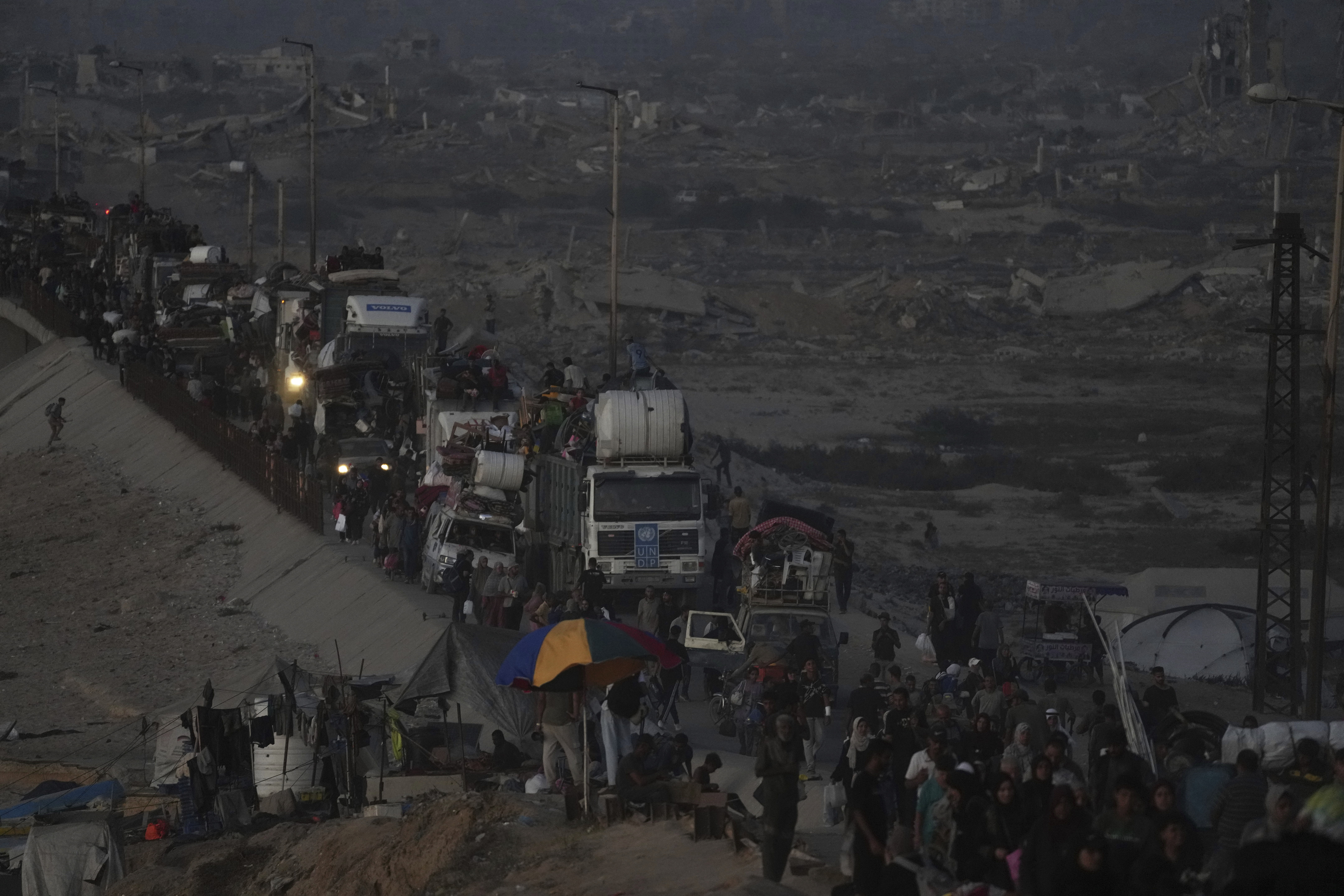 Displaced Palestinians flee Gaza City, by foot and vehicles, carrying their belongings along the coastal road in Nuseirat toward the southern Gaza Strip, Friday, Sept. 19, 2025. (Abdel Kareem Hana - AP)