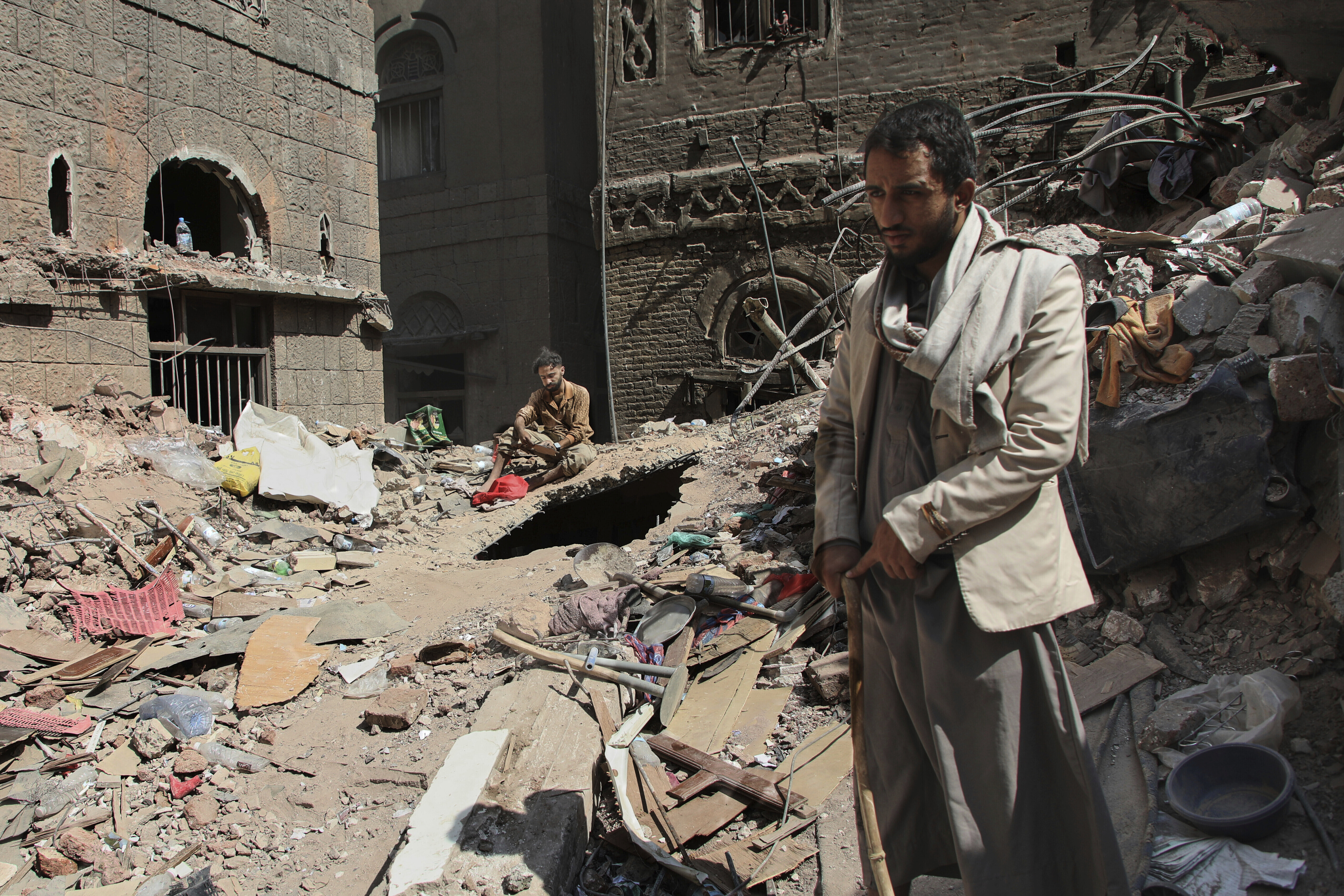 Two Yemeni men inspect the rubble of a house that was destroyed in Wednesday's Israeli airstrikes, in Sanaa, Yemen, Saturday, Sept. 13, 2025. (Osamah Abdulrahman - AP)