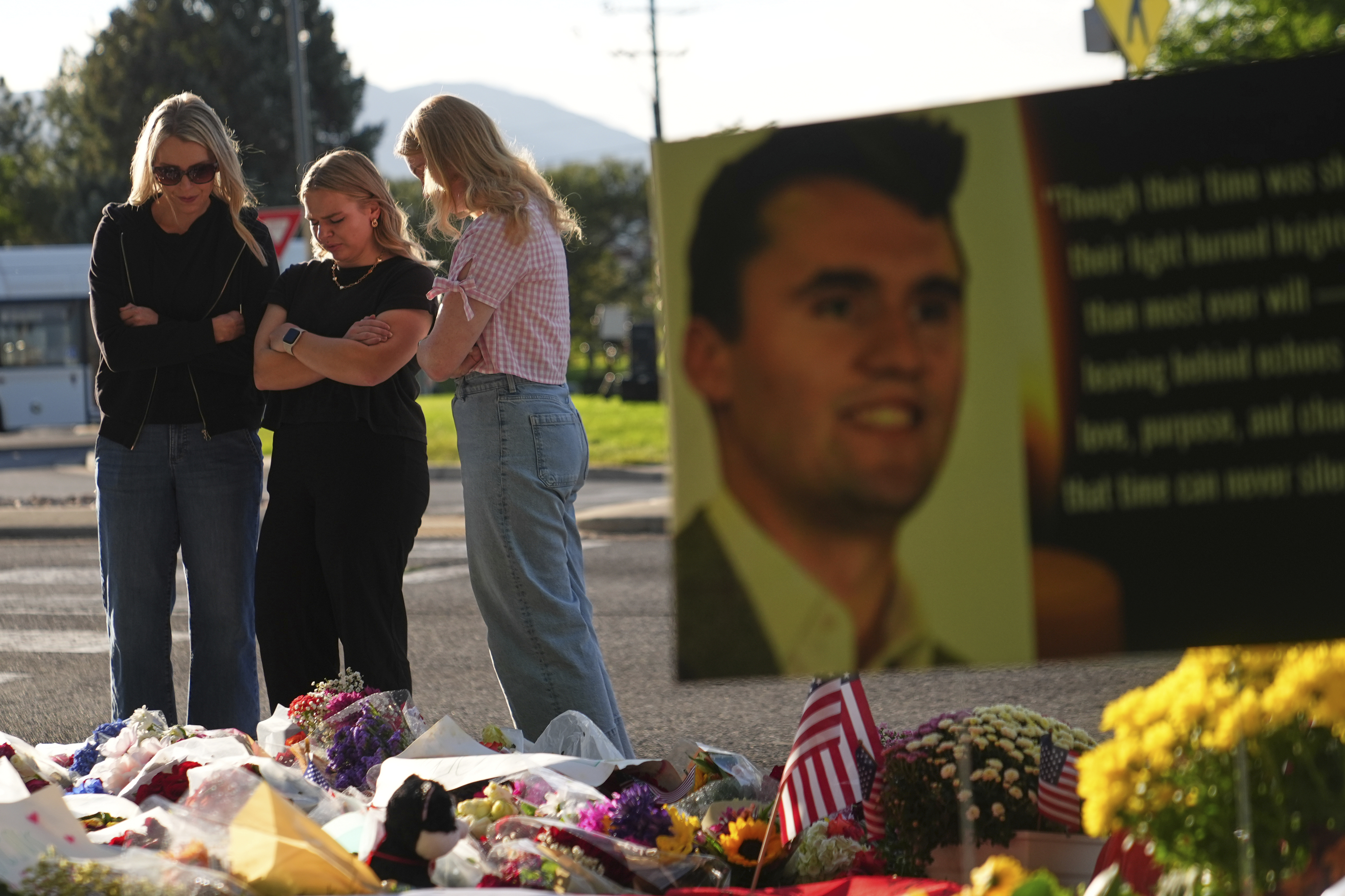Women pray at a memorial outside Utah Valley University after Turning Point USA CEO and co-founder Charlie Kirk was shot and killed, Saturday, Sept. 13, 2025, in Orem, Utah. (Lindsey Wasson - AP)