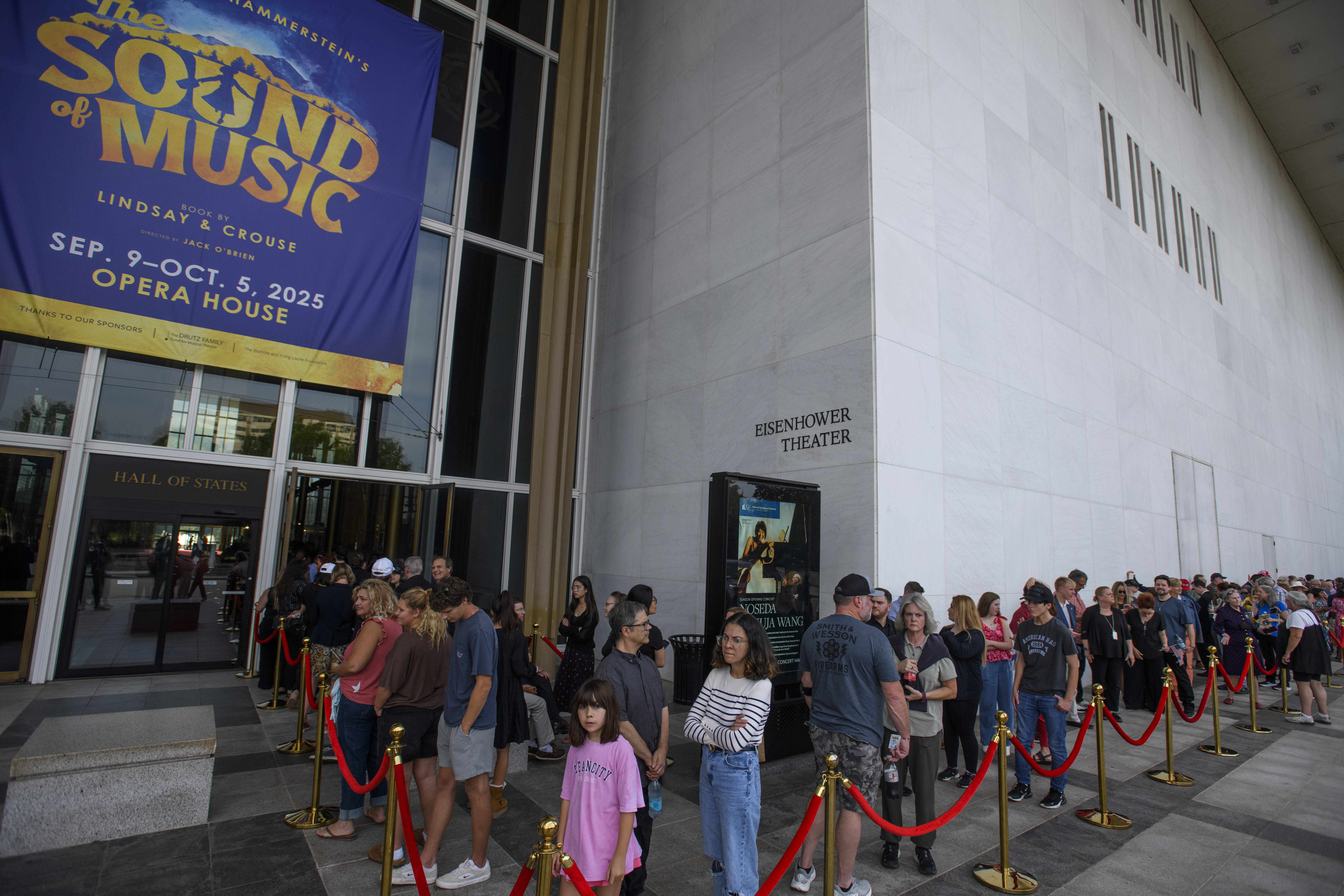 People wait in line for a memorial and prayer vigil for Charlie Kirk at the John F. Kennedy Memorial Center for the Performing Arts, Sunday, Sept. 14, 2025, in Washington. (Rod Lamkey - FR172078)