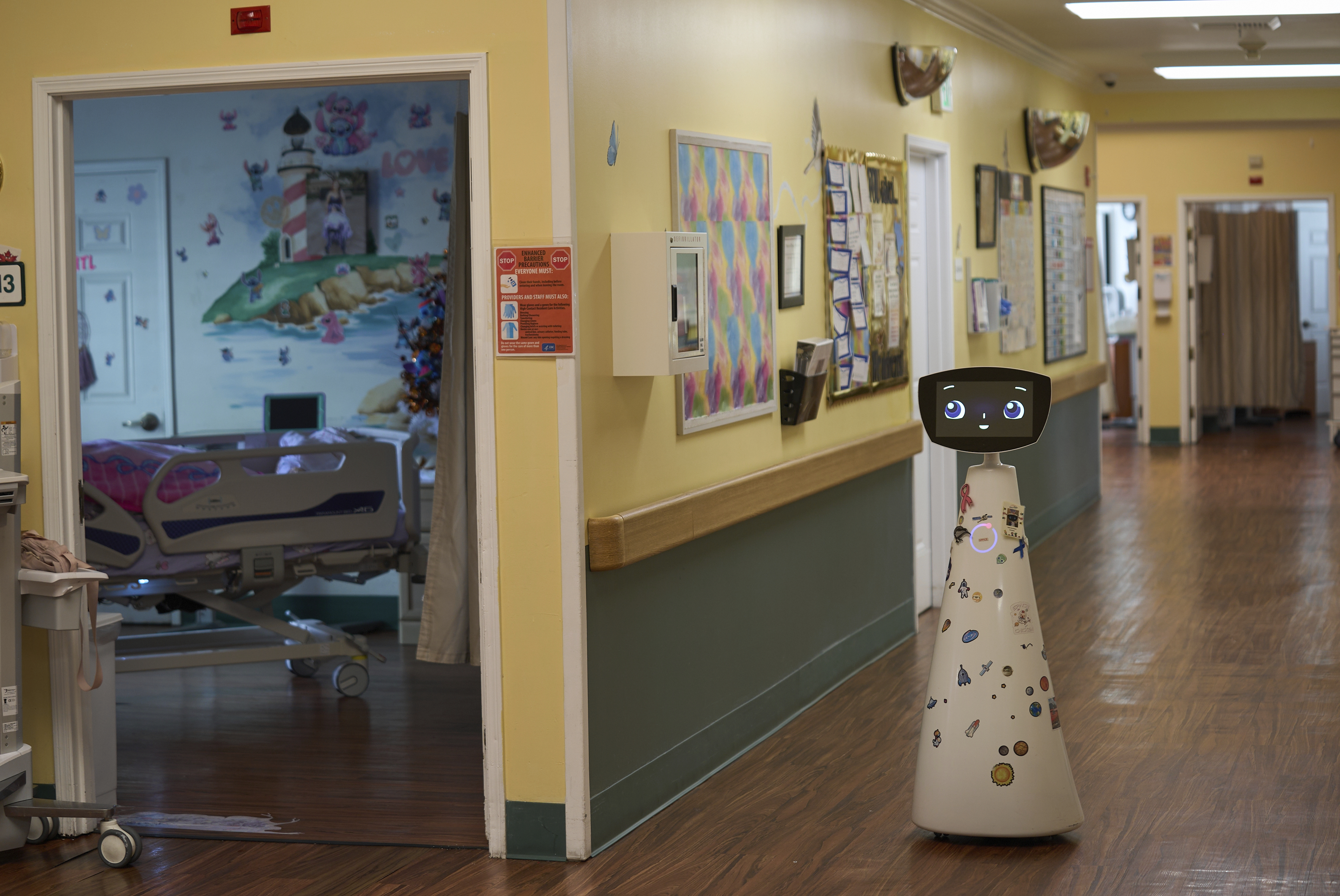 Robin the Robot, developed by Expper Technologies, visits patients' rooms at the HealthBridge Orange Specialty Pediatric Hospital in Orange, Calif., on Friday, Sept. 12, 2025. (Damian Dovarganes - AP)
