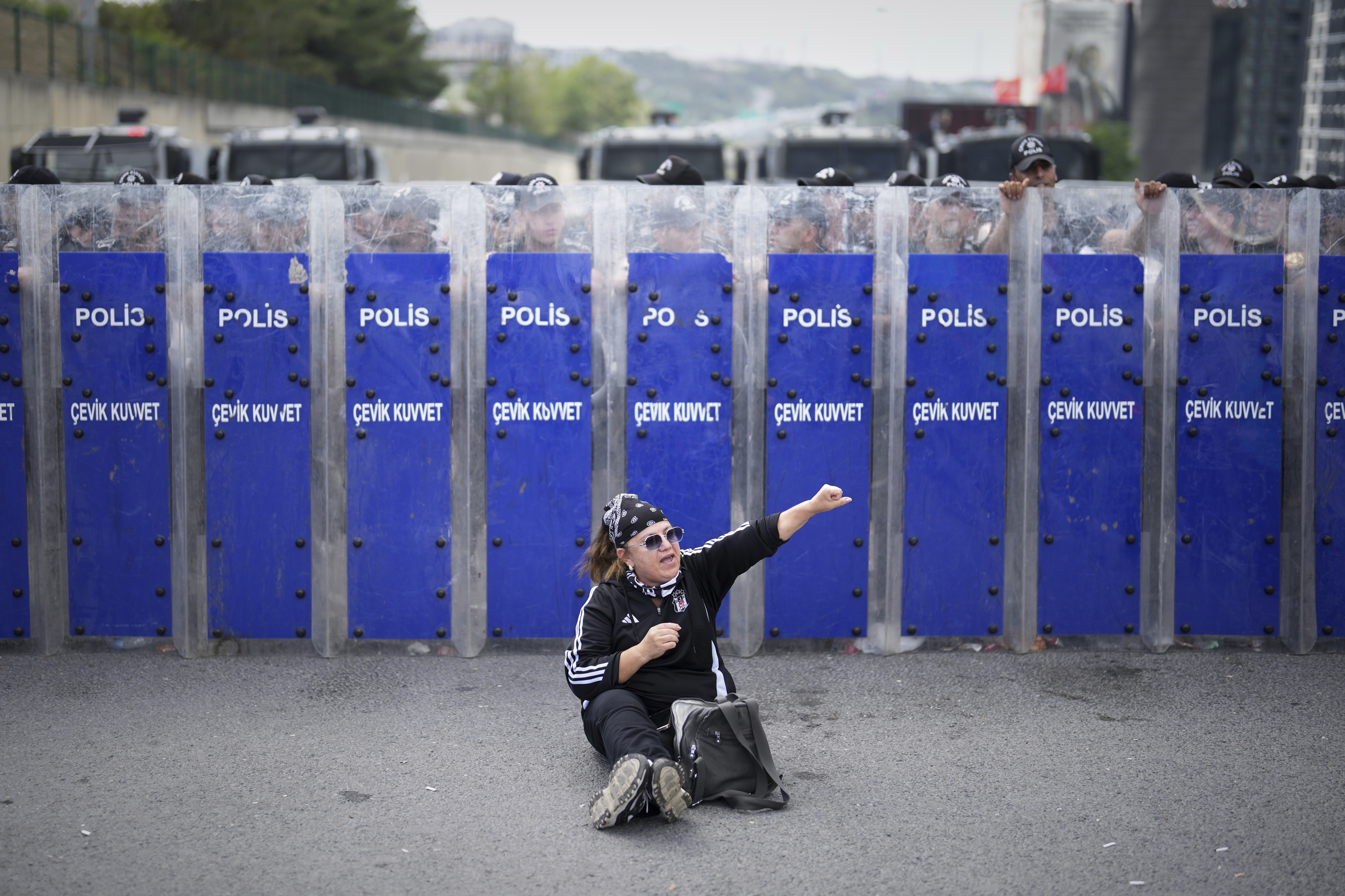 Riot police hold their shields as a supporter of Turkey's main opposition Republican People's Party (CHP) shouts slogans during a demonstration outside the party's headquarters in Istanbul, Monday, Sept. 8, 2025. (Francisco Seco - AP)