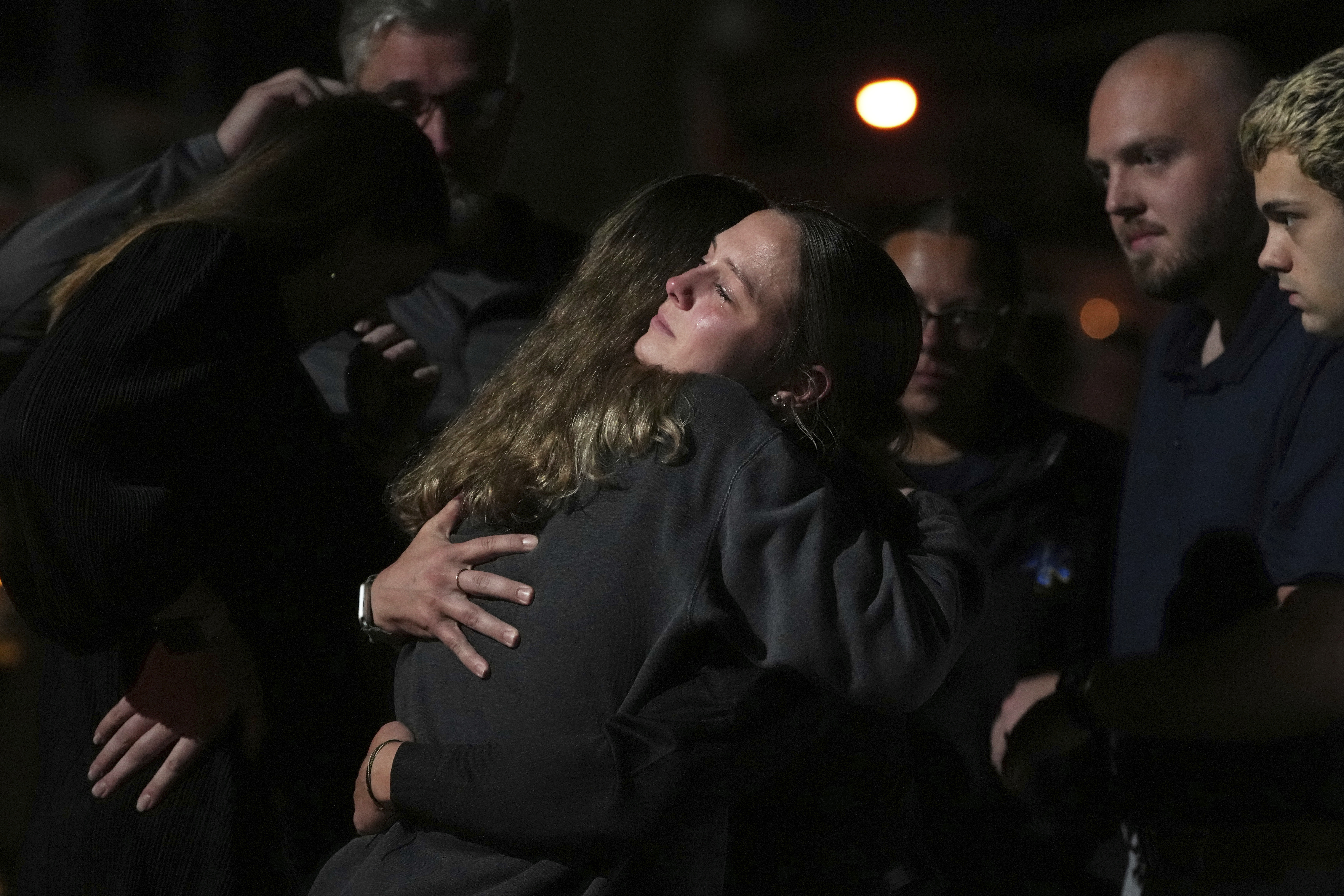 Attendees share a hug during a vigil at Spring Grove Alliance church Thursday, Sept. 18, 2025, in Spring Grove, Pa., after multiple police officers were shot and killed. (Matt Slocum - AP)