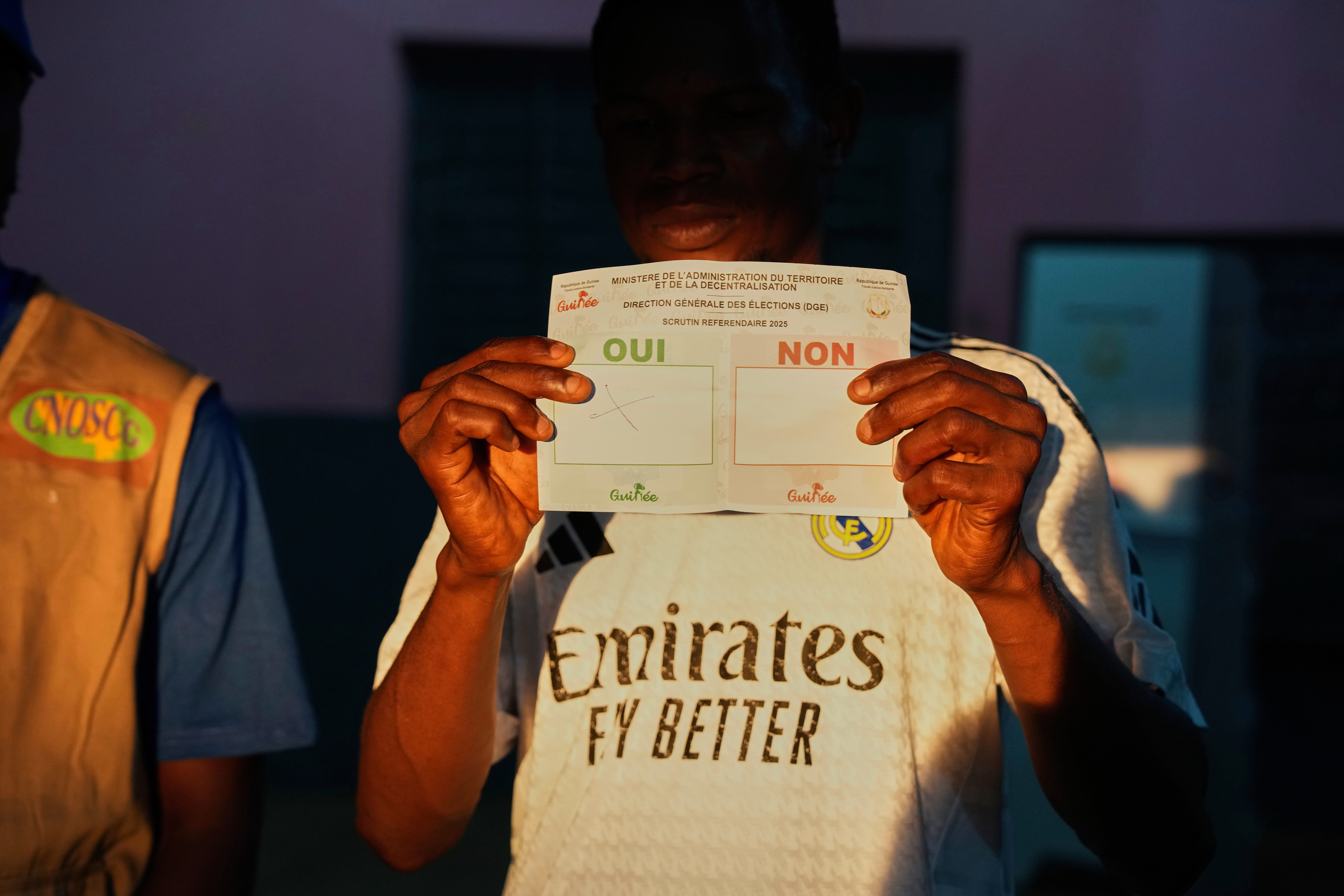 Officials count ballots at a polling station as polls close during the constitutional referendum in Conakry, Guinea, Sunday, Sept. 21, 2025. (Misper Apawu - AP)