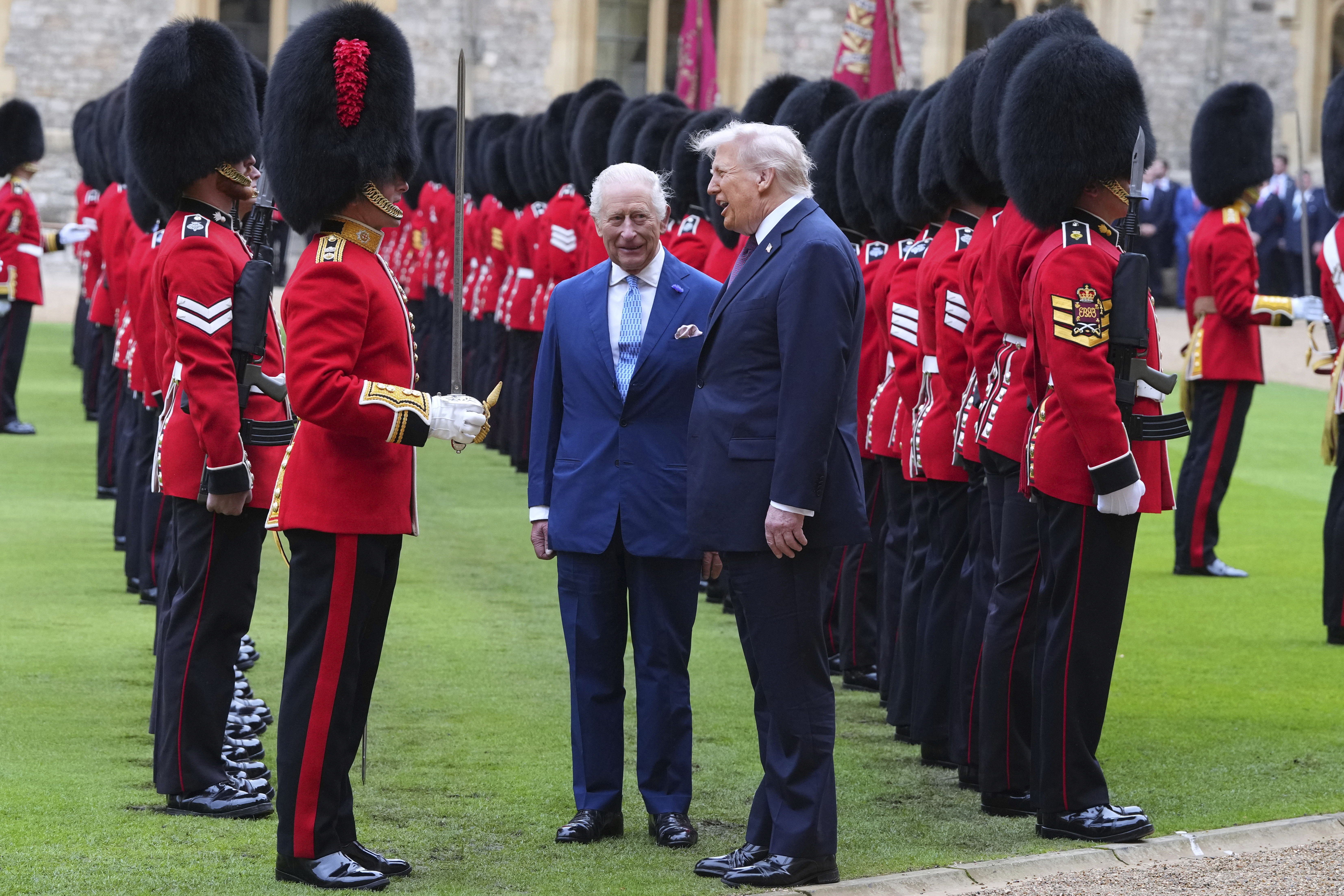 President Donald Trump and Britain's King Charles III review the Guard of Honour after the arrival at Windsor Castle in Windsor, England, Wednesday, Sept. 17, 2025. (Kirsty Wigglesworth - Pool AP)