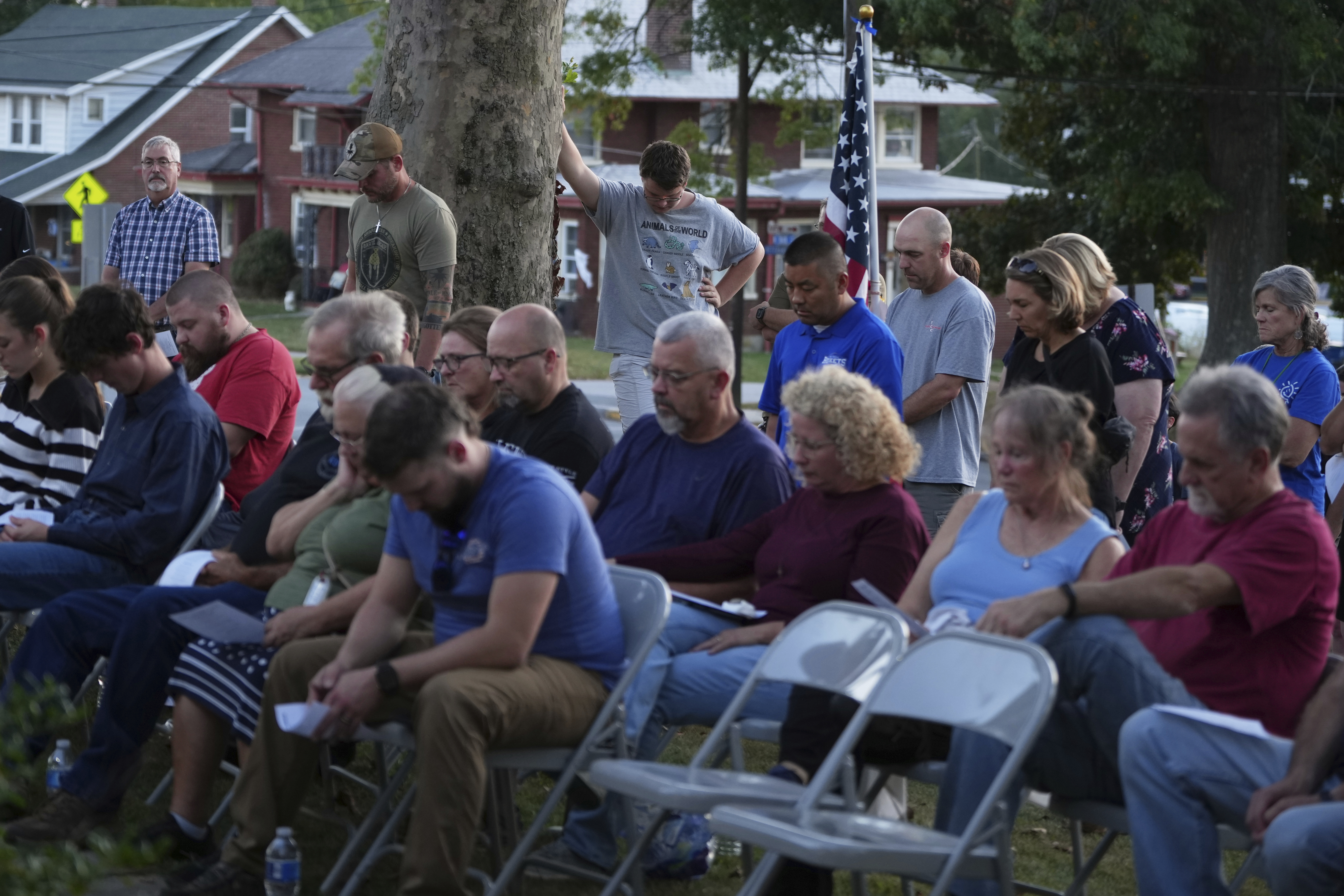 Attendees react during a vigil at Spring Grove Alliance church Thursday, Sept. 18, 2025, in Spring Grove, Pa., after multiple police officers were shot and killed. (Matt Slocum - AP)