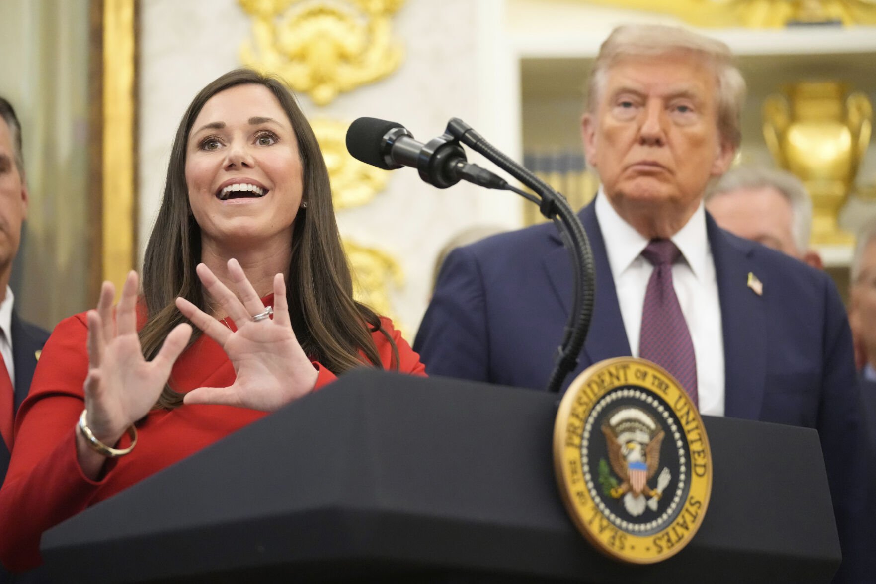 President Donald Trump listens as Sen. Katie Britt, R-Ala., speaks during an event about the relocation of U.S. Space Command headquarters from Colorado to Alabama in the Oval Office of the White House, Tuesday, Sept. 2, 2025, in Washington. (AP Photo/Mark Schiefelbein) (Mark Schiefelbein)