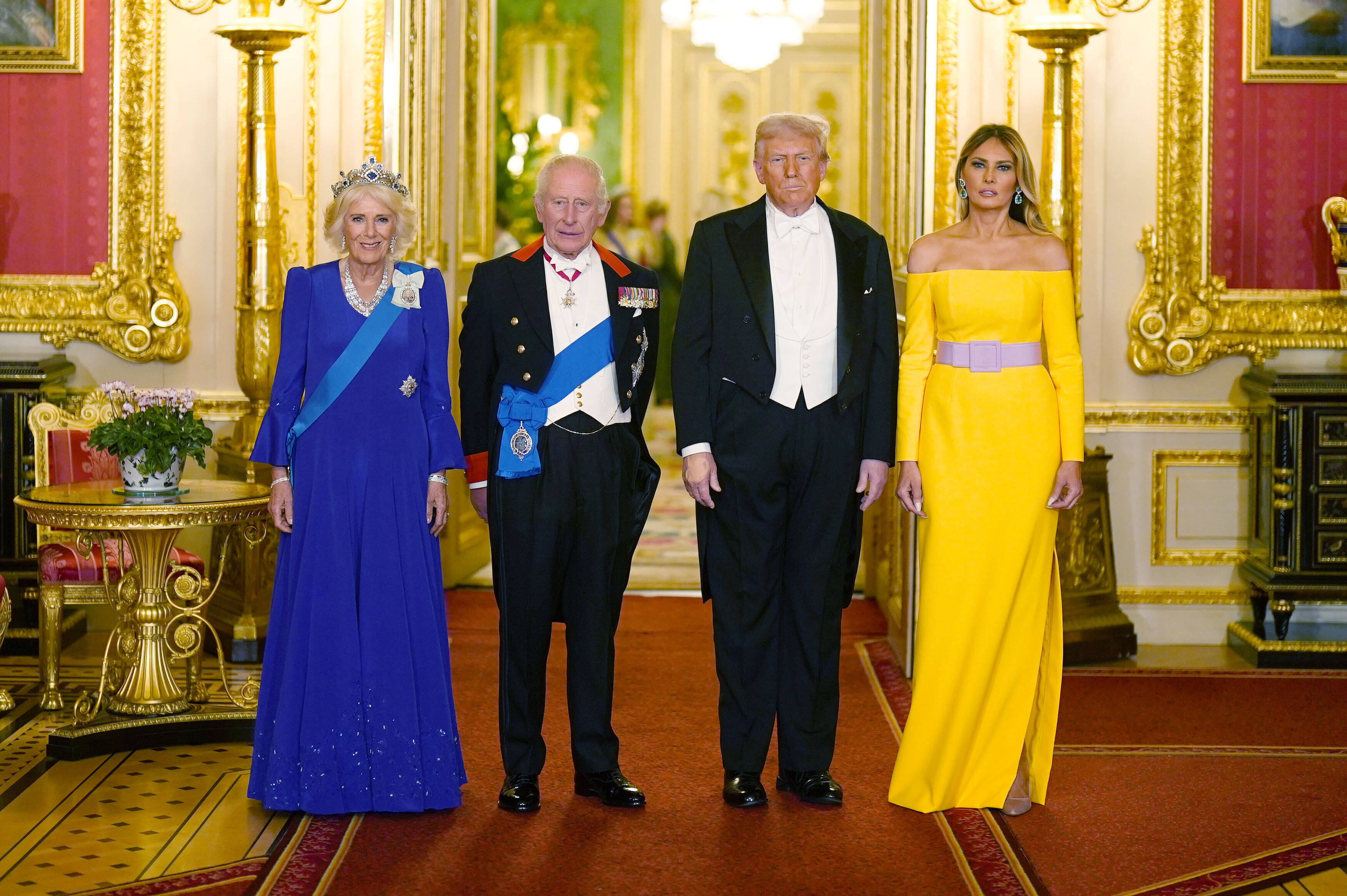 Britain's King Charles III, centre left, and U.S. President Donald Trump, centre right, pose with Queen Camilla and First Lady Melania Trump, right, at the state banquet at Windsor Castle, England, on day one of the president's second state visit to the UK, Wednesday Sept. 17, 2025. (Aaron Chown - Pool PA)
