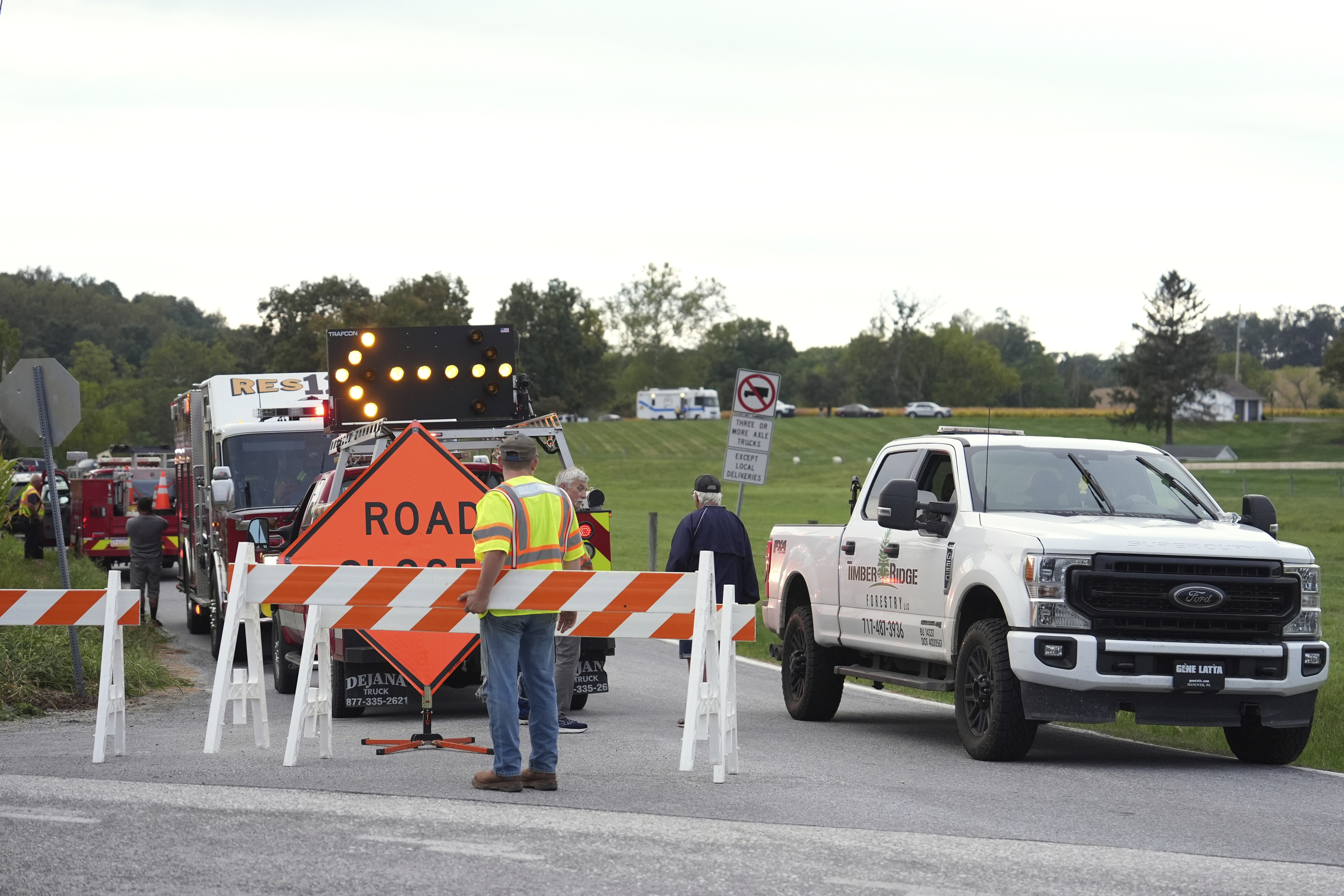 Emergency personnel block a road after a shooting involving police officers on Wednesday, Sept. 17, 2025, in North Codorus, Pa. (Matt Slocum - AP)