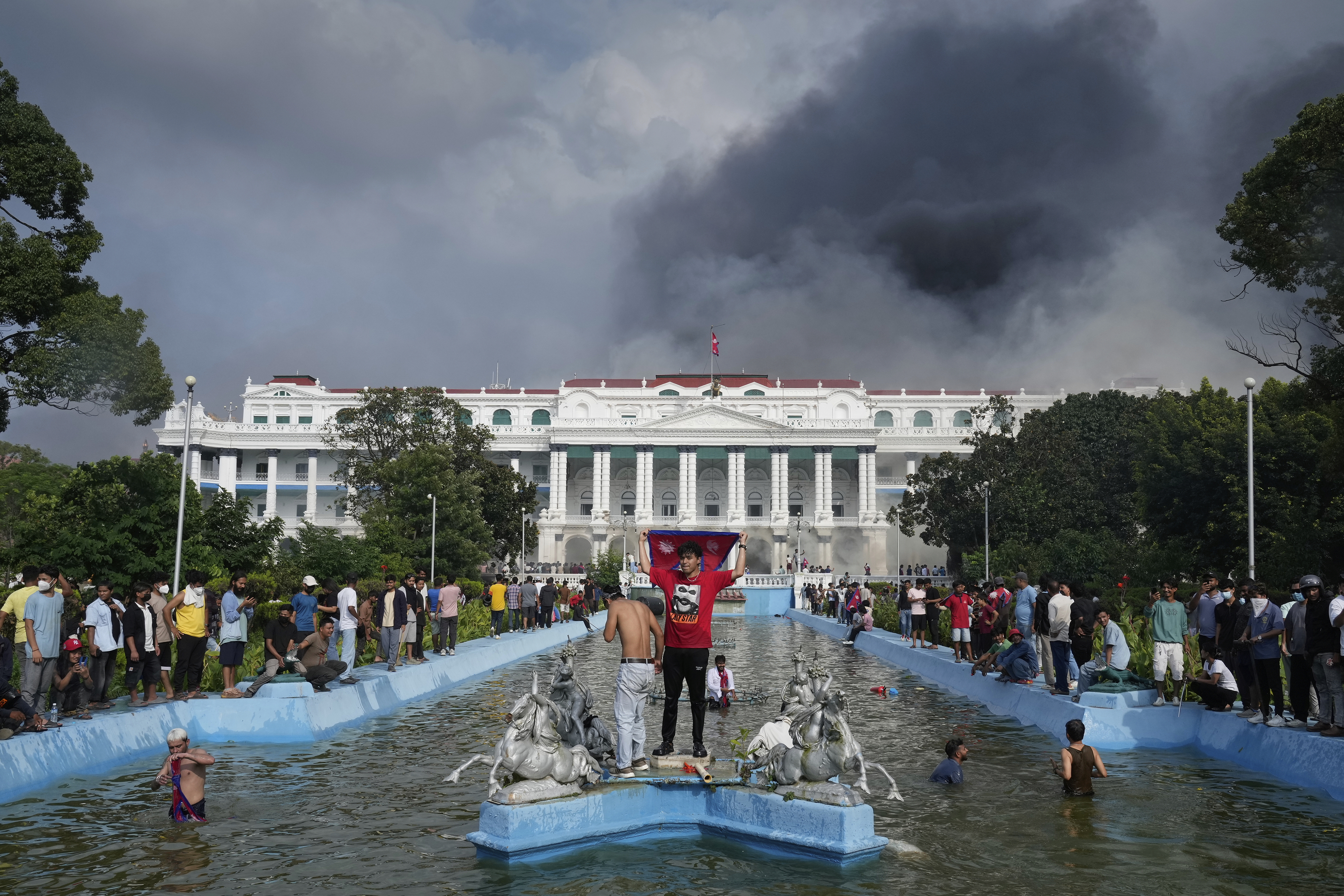 Protesters throng Singha Durbar, the seat of Nepal's government's various ministries and offices during a protest against social media ban and corruption in Kathmandu, Nepal, Tuesday, Sept. 9, 2025. (Niranjan Shrestha - AP)