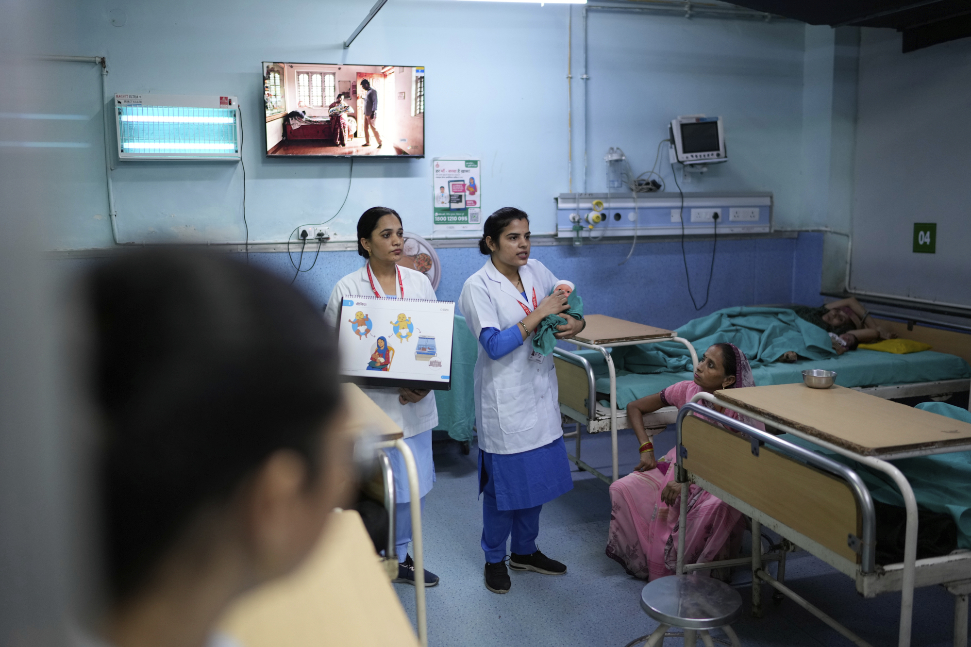 Nurses brief pregnant mothers and their caregivers about antenatal Care Companion Program (CCP) in a maternity ward of a government hospital in Gurugram, a satellite city of New Delhi, India, on Aug. 7, 2025. (Manish Swarup - AP)