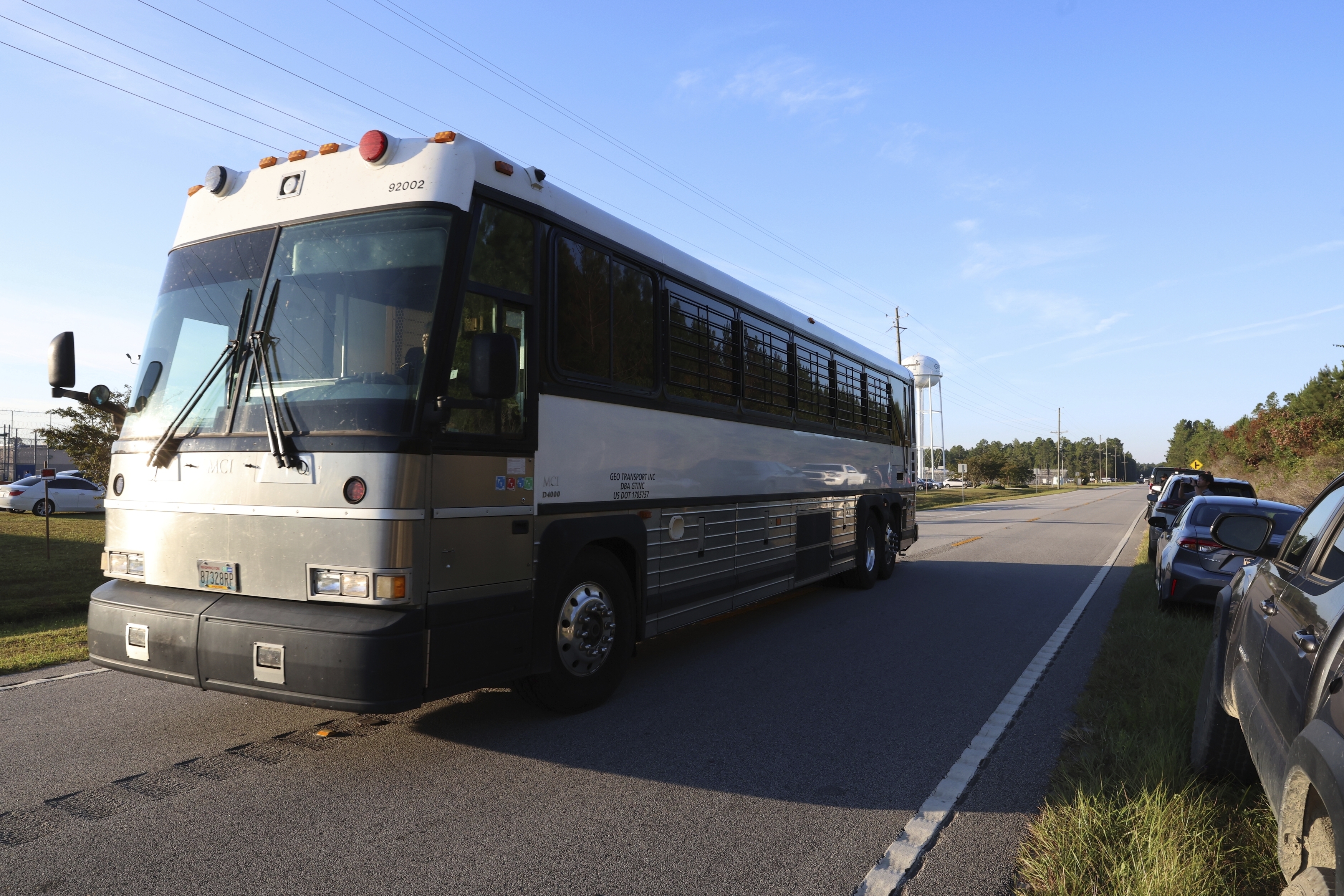 A bus leaves the Folkston Immigration and Customs Enforcement processing center, Wednesday, Sept. 10, 2025, in Folkston, Ga. (Gary McCullough - FR171182 AP)