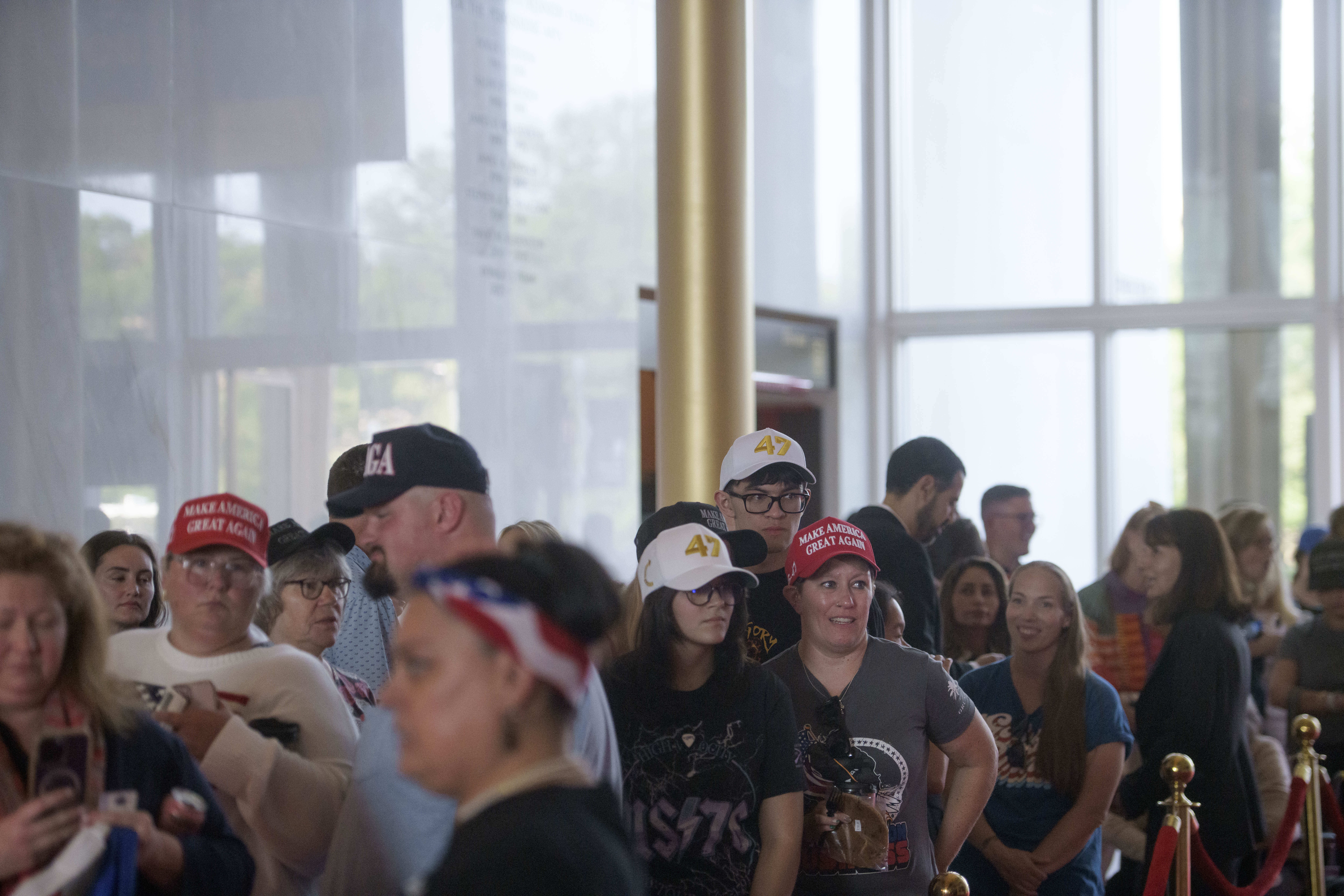 People wait in line for a memorial and prayer vigil for Charlie Kirk at the John F. Kennedy Memorial Center for the Performing Arts, Sunday, Sept. 14, 2025, in Washington. (Rod Lamkey - FR172078)