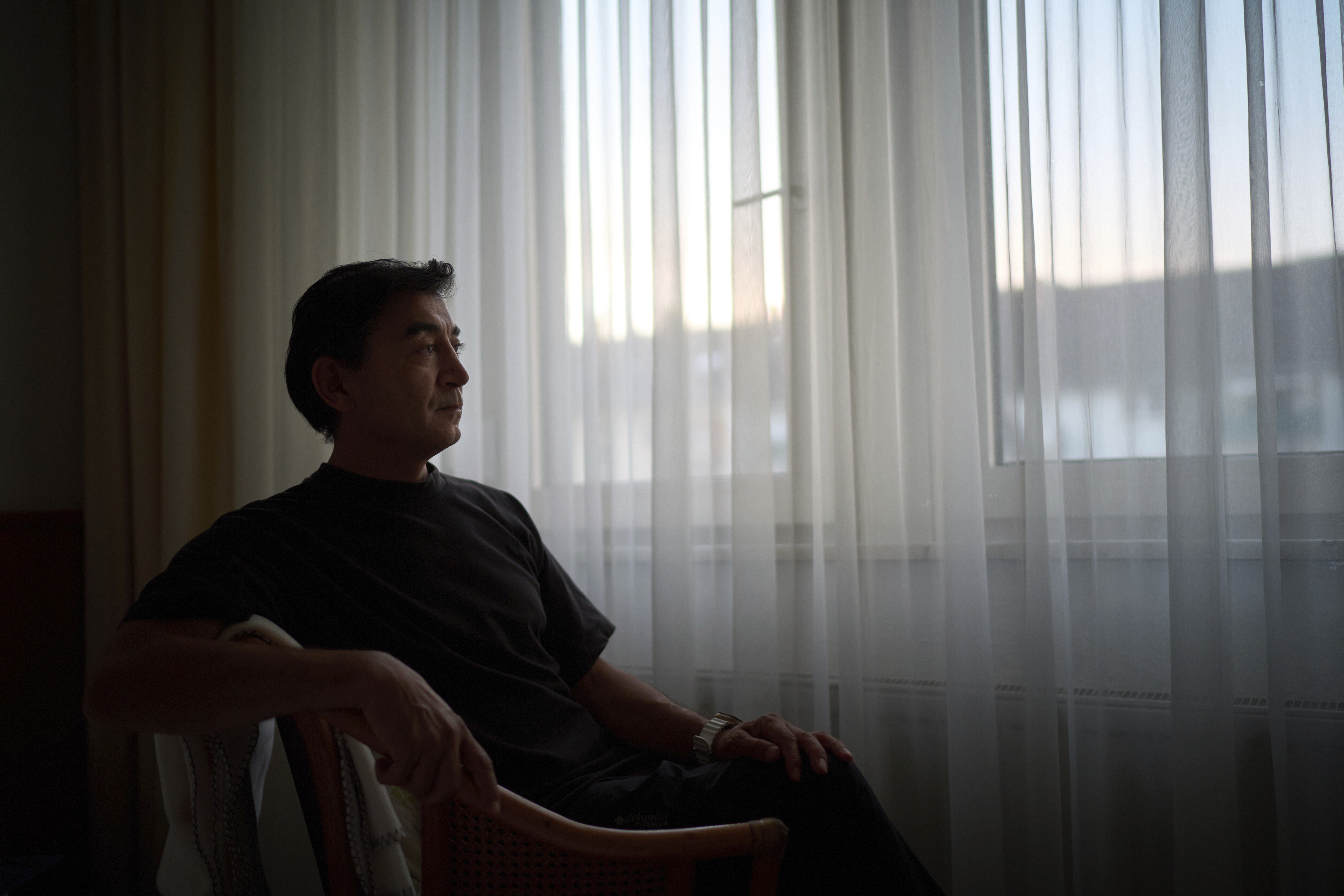 Former Xinjiang government engineer Nureli Abliz, who saw firsthand how surveillance technology flagged thousands of people in China for detention, even when they had committed no crime, sits for a portrait in Mannheim, Germany, where he now lives in exile, Wednesday, July 23, 2025. (David Goldman - AP)