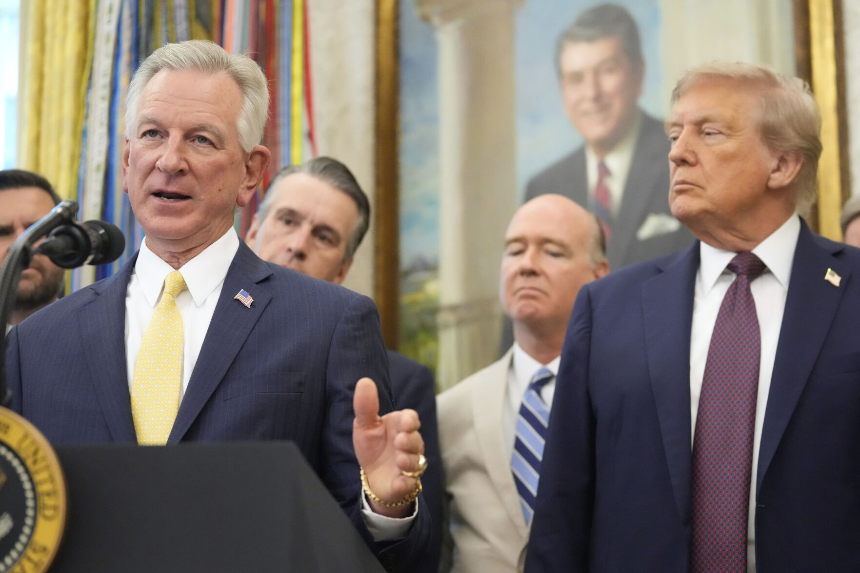 President Donald Trump listen as Sen. Tommy Tuberville, R-Ala., speaks during an event about the relocation of U.S. Space Command headquarters from Colorado to Alabama in the Oval Office of the White House, Tuesday, Sept. 2, 2025, in Washington. (AP Photo/Mark Schiefelbein) (Mark Schiefelbein)