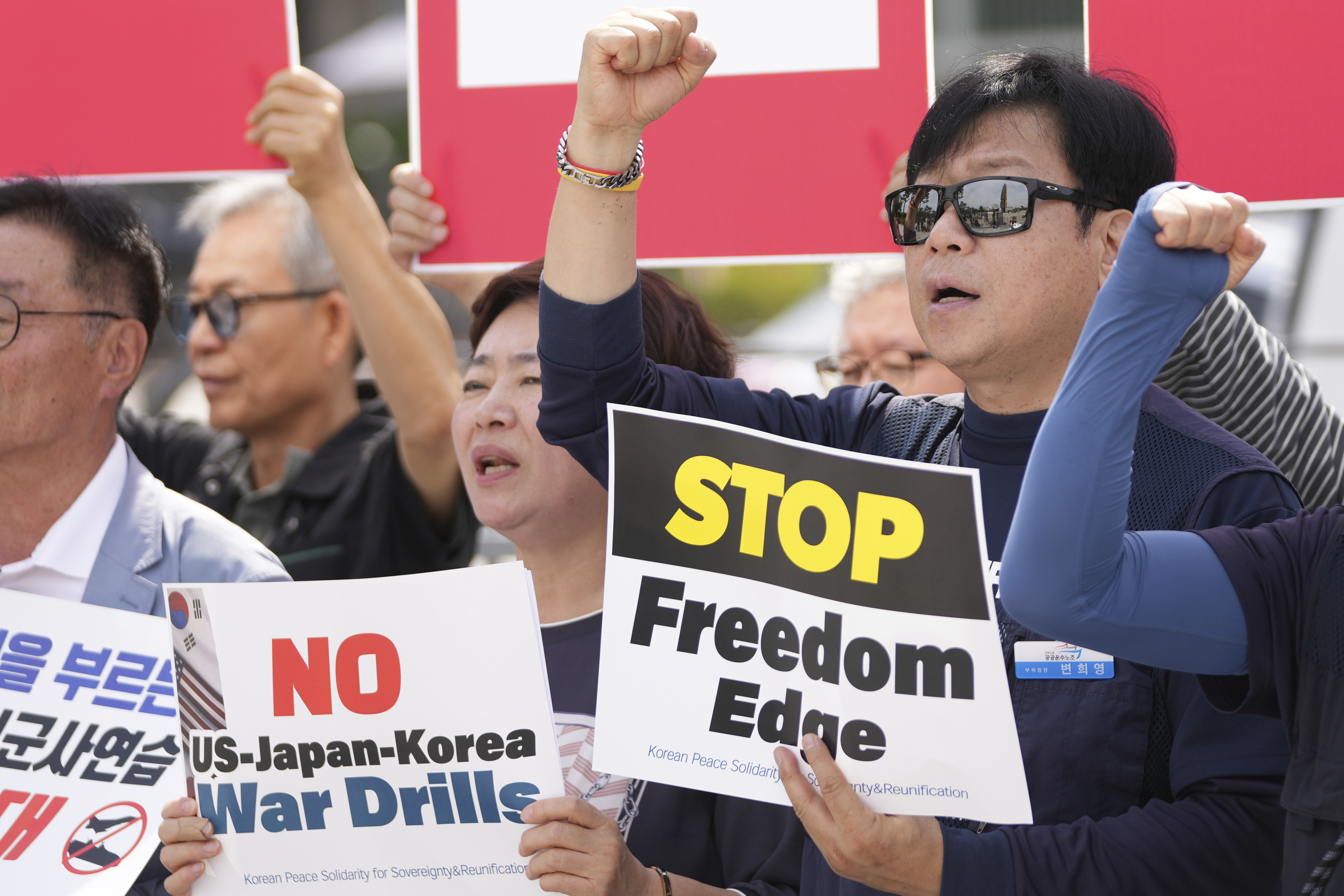 Protesters shout slogans during a press conference to oppose the military exercise called Freedom Edge in Seoul, South Korea, Monday, Sept. 15, 2025. (Lee Jin-man - AP)
