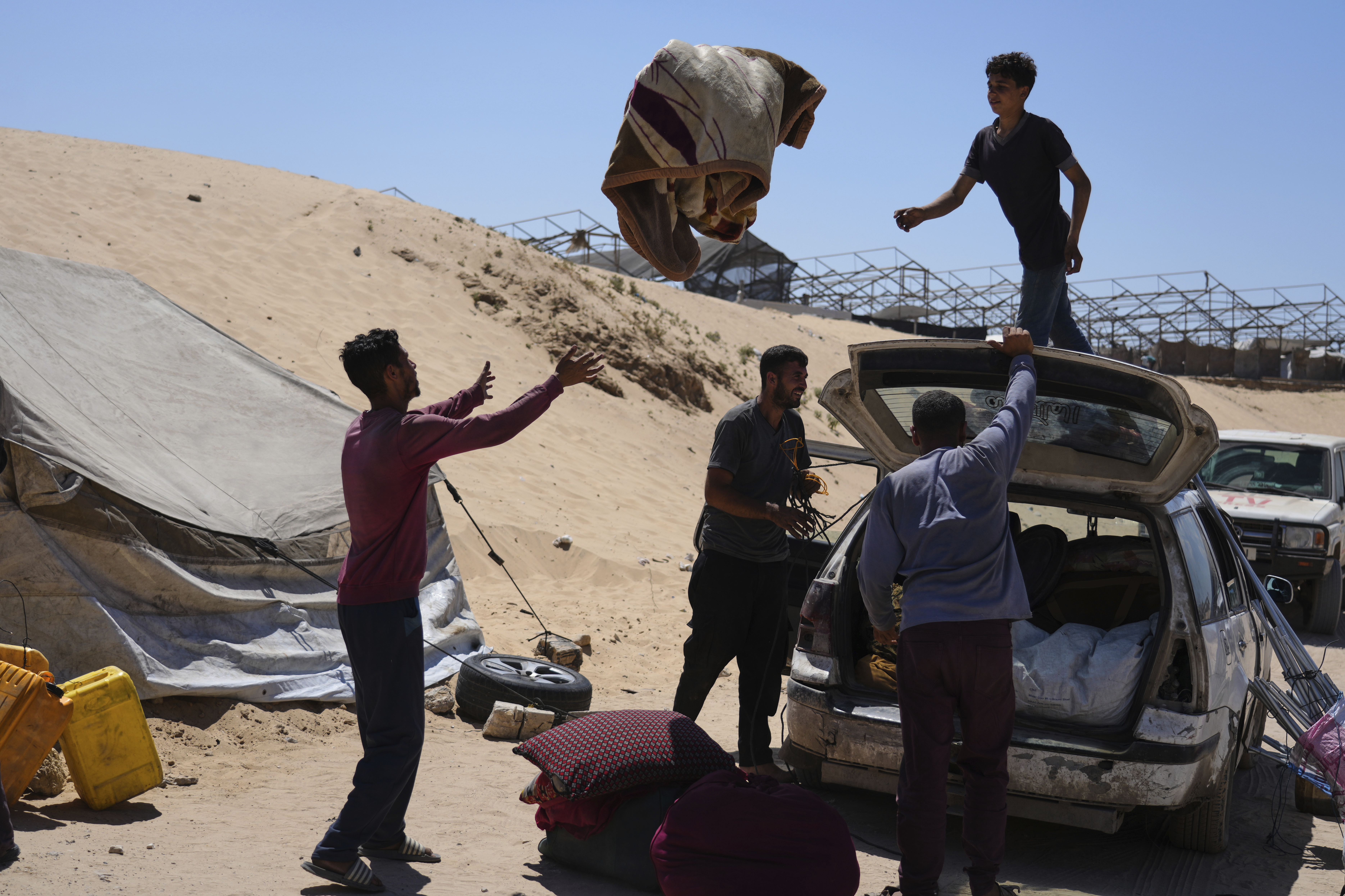 Members of the Abdullah family who were evacuated from Gaza City set up their tent in a camp for displaced Palestinians in Muwasi, an area that Israel has designated as a safe zone, in Khan Younis southern Gaza Strip, Wednesday, Sept. 10, 2025. (Jehad Alshrafi - AP)