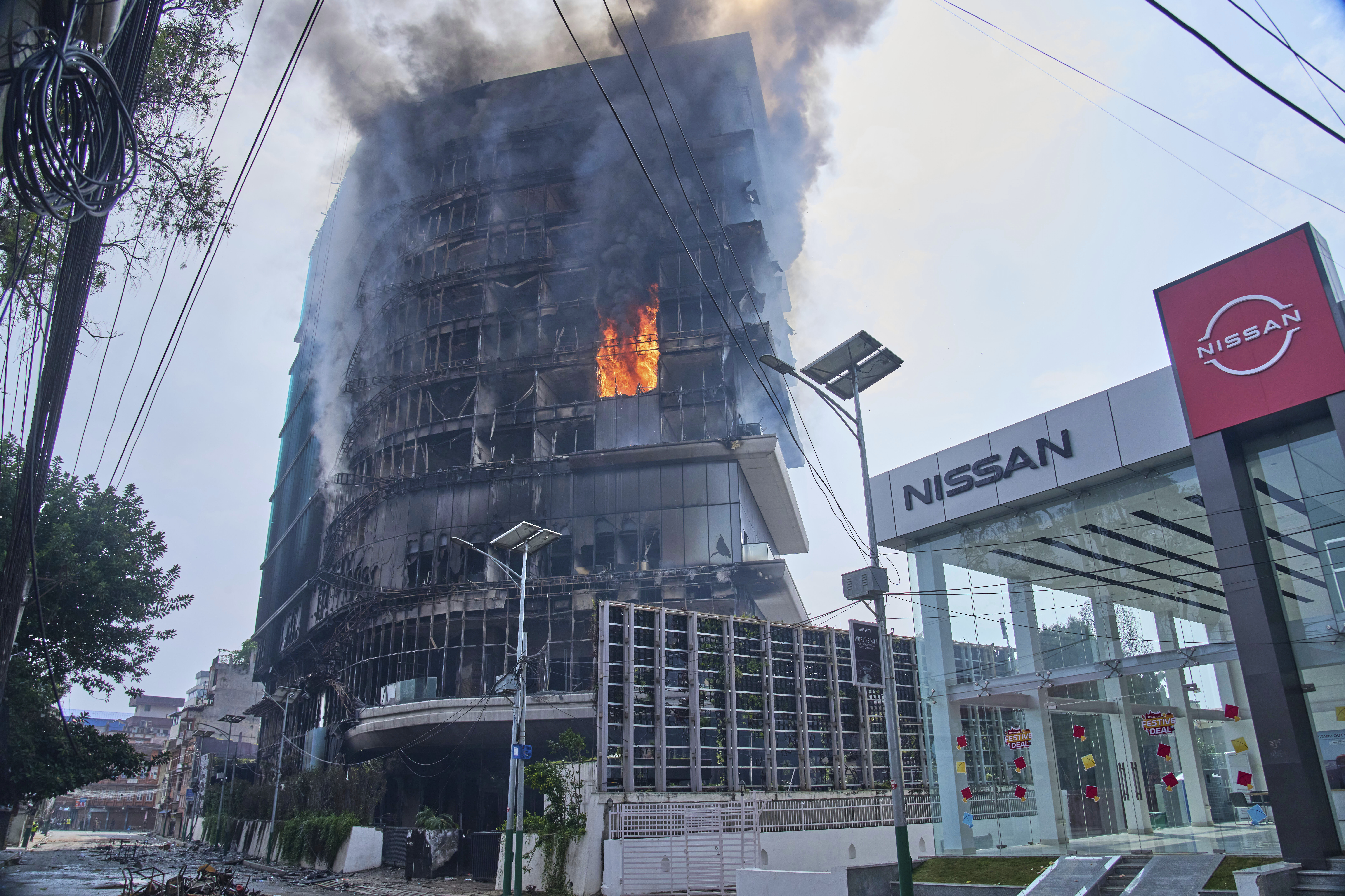 Flames rise from Hilton hotel after it was set on fire in Kathmandu, Nepal, Wednesday, Sept.10, 2025. (Niranjan Shrestha - AP)