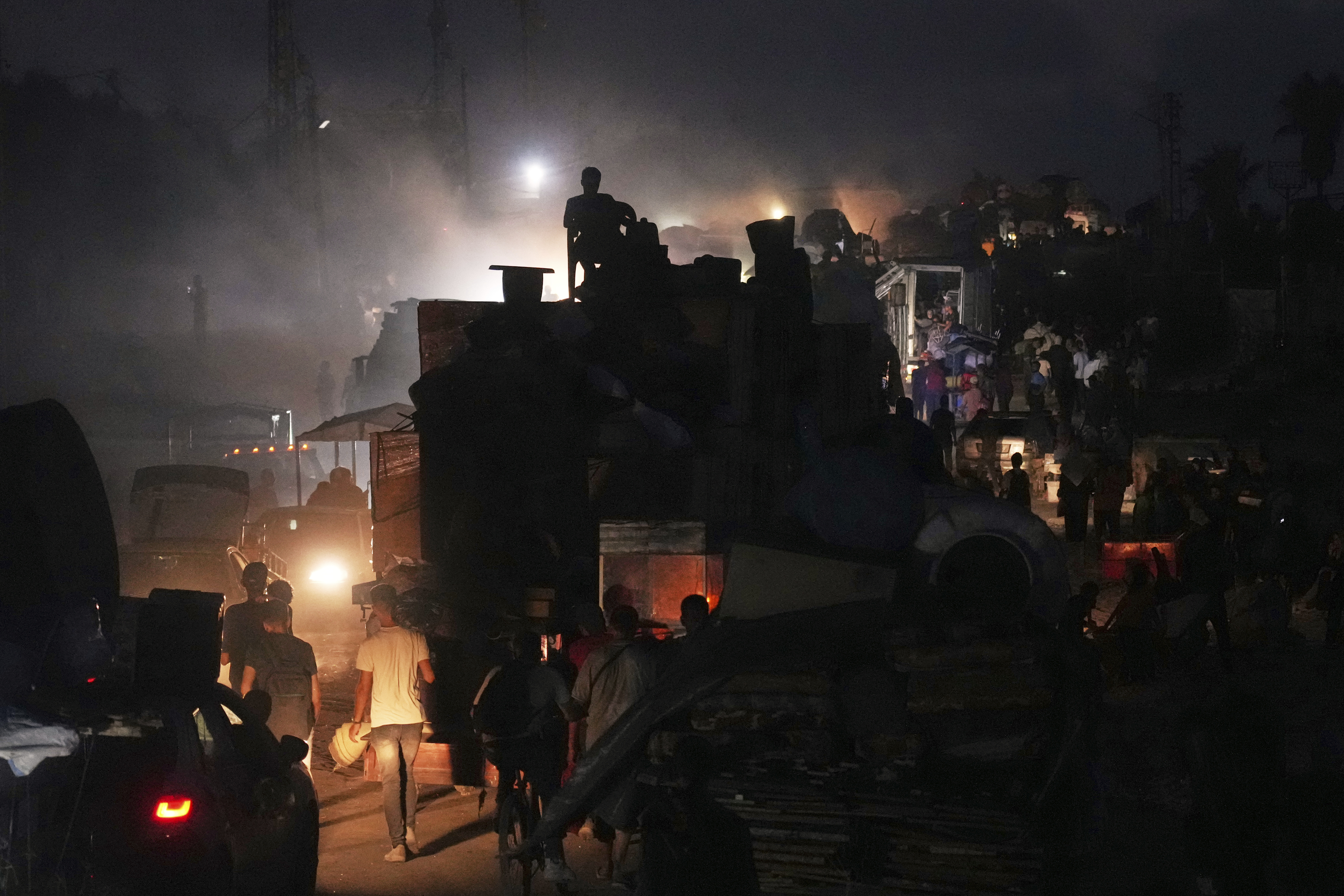 Displaced Palestinians flee Gaza City by foot and vehicles, carrying their belongings along the coastal road toward southern Gaza, Thursday, Sept. 18, 2025. (Abdel Kareem Hana - AP)