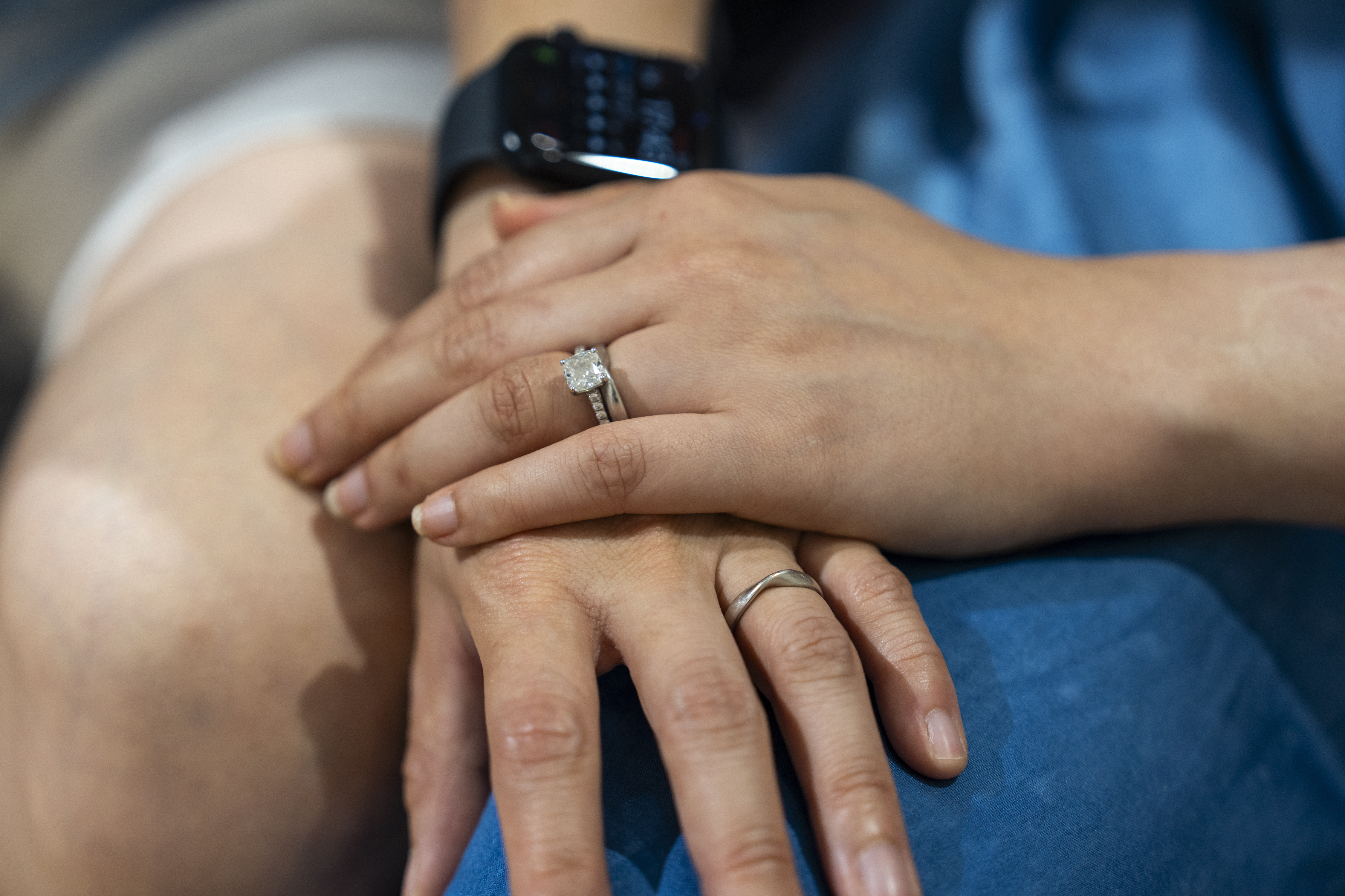 Same-sex partners Jaedyn Yu, right, and Gloria Tsang wear their wedding rings in Hong Kong, Sunday, Aug. 24, 2025. (Chan Long Hei - AP)
