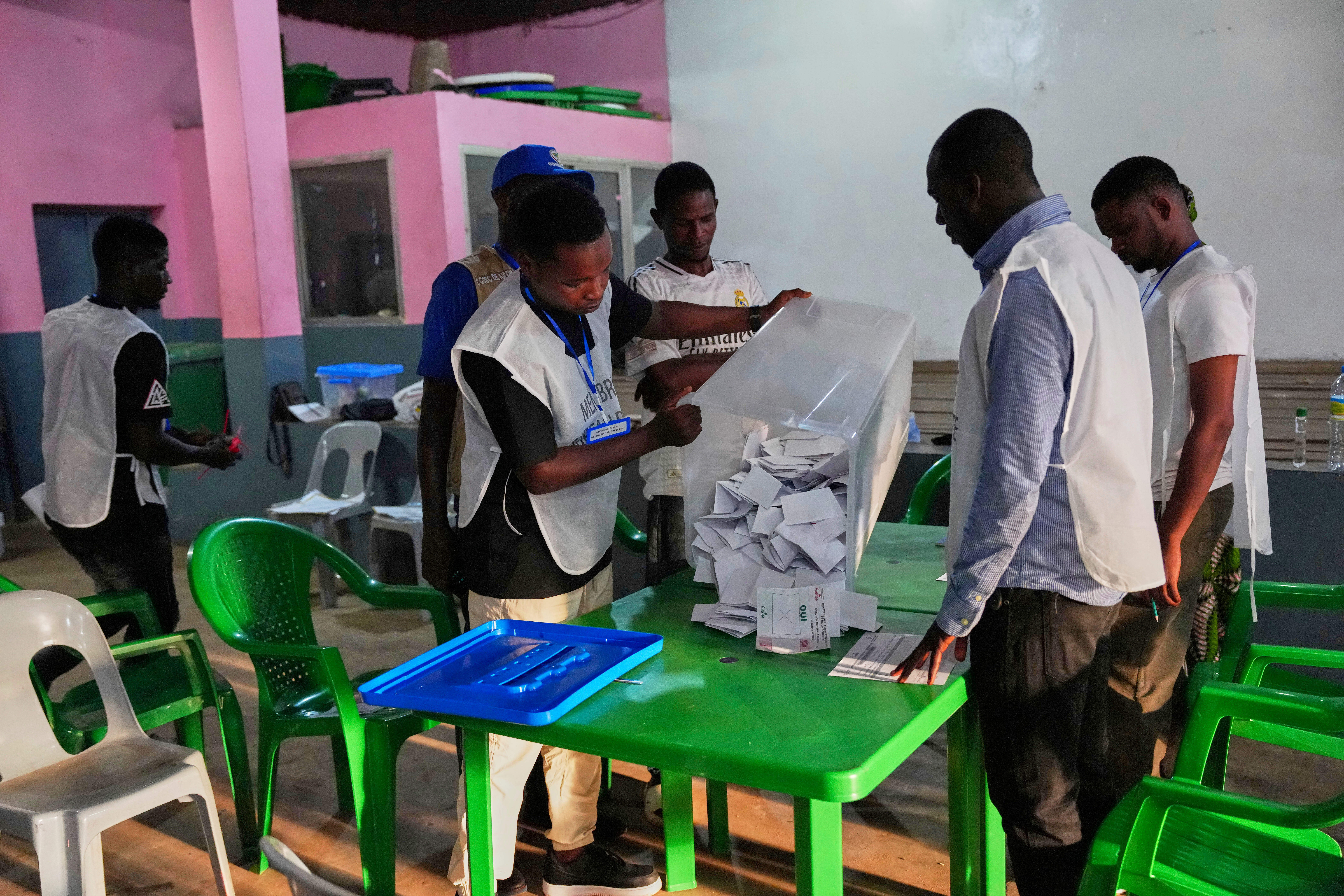 Voting slips are emptied from a ballot box at a polling station as polls close during the constitutional referendum in Conakry, Guinea, Sunday, Sept. 21, 2025. (Misper Apawu - AP)