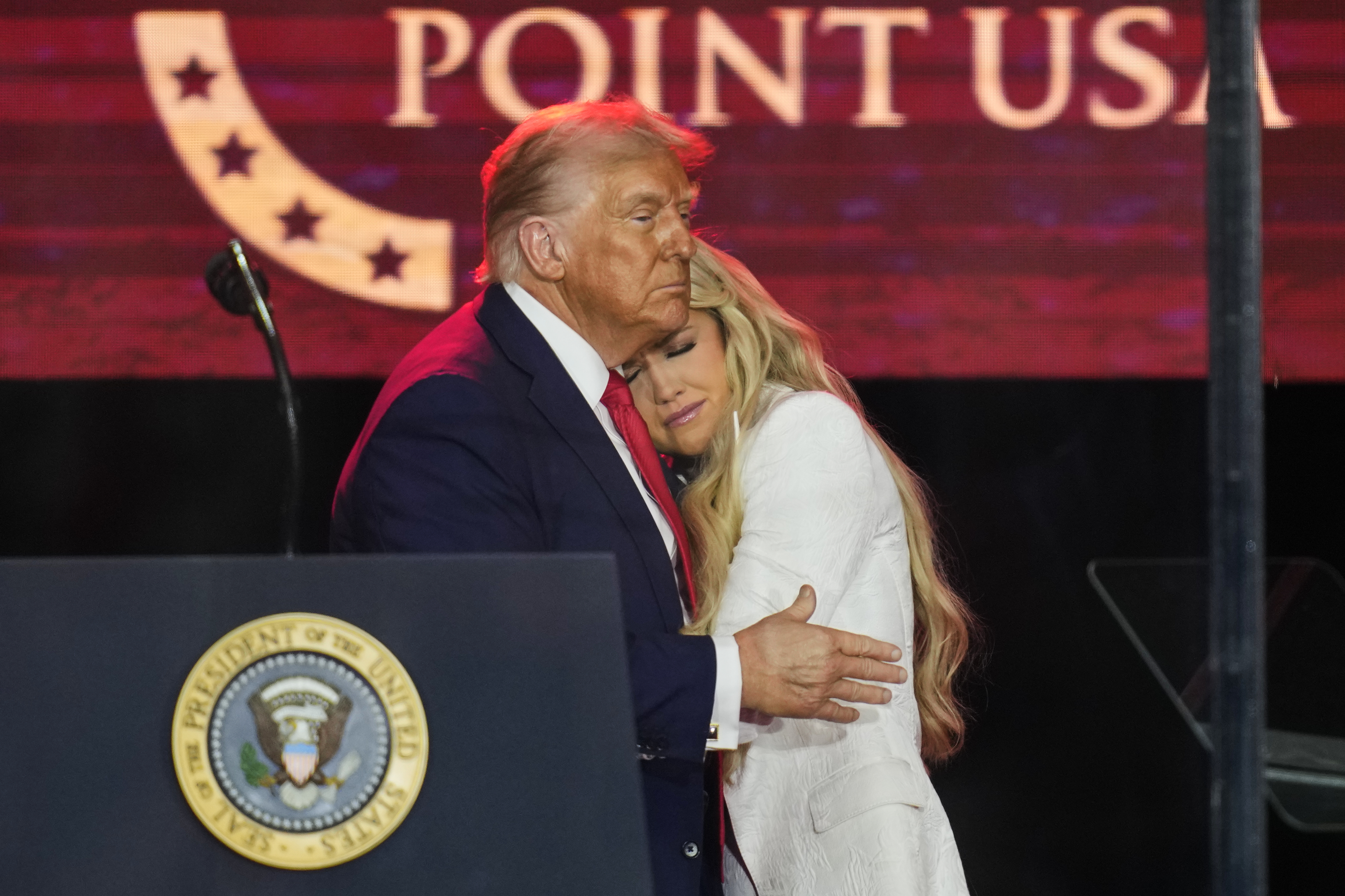 President Donald Trump embraces Erika Kirk at a memorial for conservative activist Charlie Kirk, Sunday, Sept. 21, 2025, at State Farm Stadium in Glendale, Ariz. (John Locher - AP)